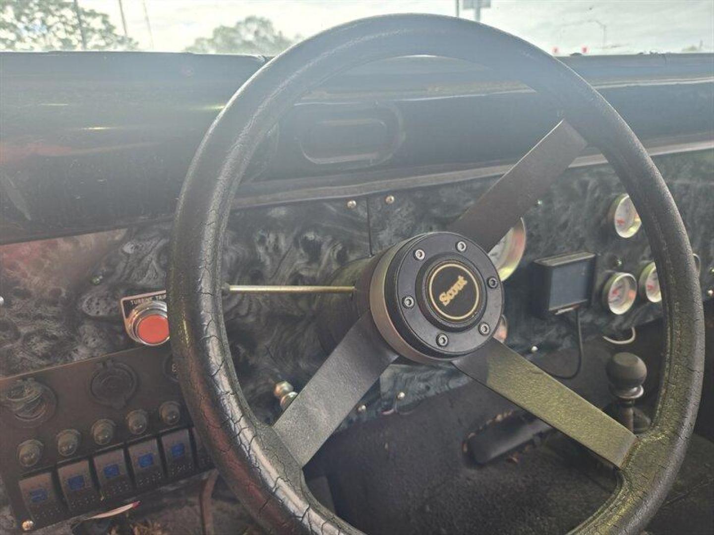 1984 Black Jeep CJ-7 2dr (1JCCM87E2ET) with an 4.2L I6 OHV 12V 2 BBL Engine engine, 4 Speed Manual transmission, located at 25355 Eames Street, Channahon, IL, 60410, (815) 467-1807, 41.429108, -88.228432 - ** V-8 MOTOR, JEEP COMMANDER FRAME, STARTS, RUNS, DRIVES, DOES NOT STEER DUE TO BENT STEERING COMPONENT. ** This 1984 Jeep CJ-7 2dr comes equipped with a robust 4.2L I6 OHV 12V 2 BBL Engine, offering reliable performance for any adventure. With remarkably low mileage, averaging less than 1,000 miles - Photo#5
