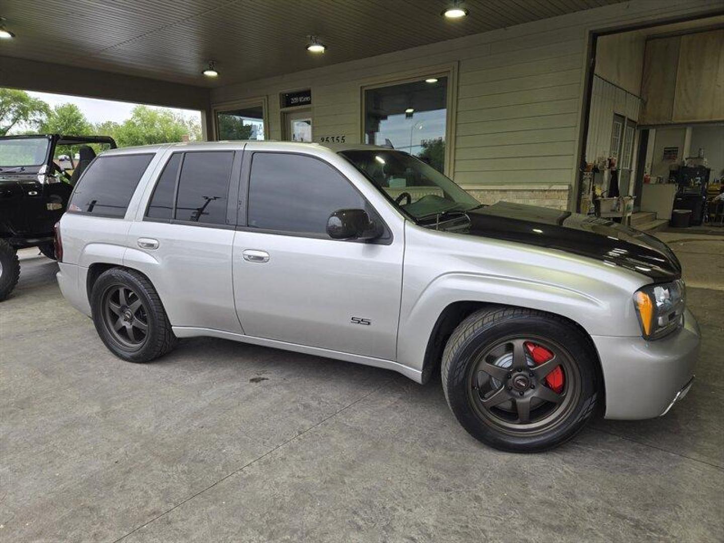2006 Silver Chevrolet Trailblazer LT (1GNES13H462) with an 6.0L V8 OHV 16V FI Engine engine, Automatic transmission, located at 25355 Eames Street, Channahon, IL, 60410, (815) 467-1807, 41.429108, -88.228432 - ** SOUTHERN TRUCK NO RUST, HEADERS, EXHAUST, SUSPENSION MODS, CLEAN TRUCK.** This 2006 Chevrolet Trailblazer SS in Silver with a Black interior is a standout SUV with a mileage of below 137,000 miles, averaging less than 7,000 miles per year. This vehicle is in excellent overall condition. The facto - Photo#1