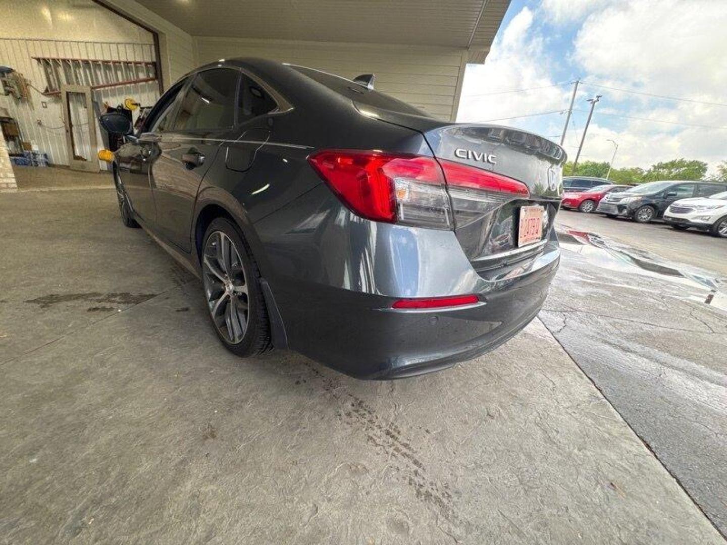 2024 Meteorite Gray Metallic Honda Civic Touring (2HGFE1F9XRH) with an 1.5L Turbo I4 180hp 177ft. lbs. engine, Automatic transmission, located at 25355 Eames Street, Channahon, IL, 60410, (815) 467-1807, 41.429108, -88.228432 - Introducing the 2024 Honda Civic Touring - a powerhouse on the road! This sleek sedan is equipped with a robust 1.5L Turbo I4 engine, delivering an impressive 180hp and 177ft. lbs. of torque for an exhilarating driving experience. Straight from the factory, this Civic Touring comes loaded with top- - Photo#5