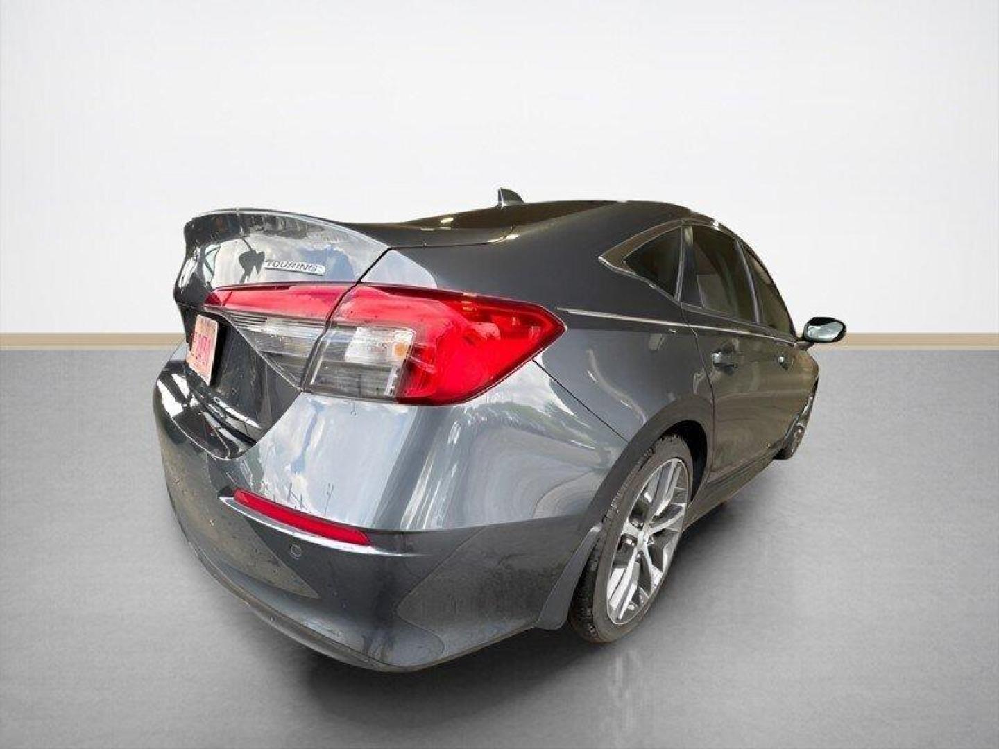 2024 Meteorite Gray Metallic Honda Civic Touring (2HGFE1F9XRH) with an 1.5L Turbo I4 180hp 177ft. lbs. engine, Automatic transmission, located at 25355 Eames Street, Channahon, IL, 60410, (815) 467-1807, 41.429108, -88.228432 - Introducing the 2024 Honda Civic Touring - a powerhouse on the road! This sleek sedan is equipped with a robust 1.5L Turbo I4 engine, delivering an impressive 180hp and 177ft. lbs. of torque for an exhilarating driving experience. Straight from the factory, this Civic Touring comes loaded with top- - Photo#2