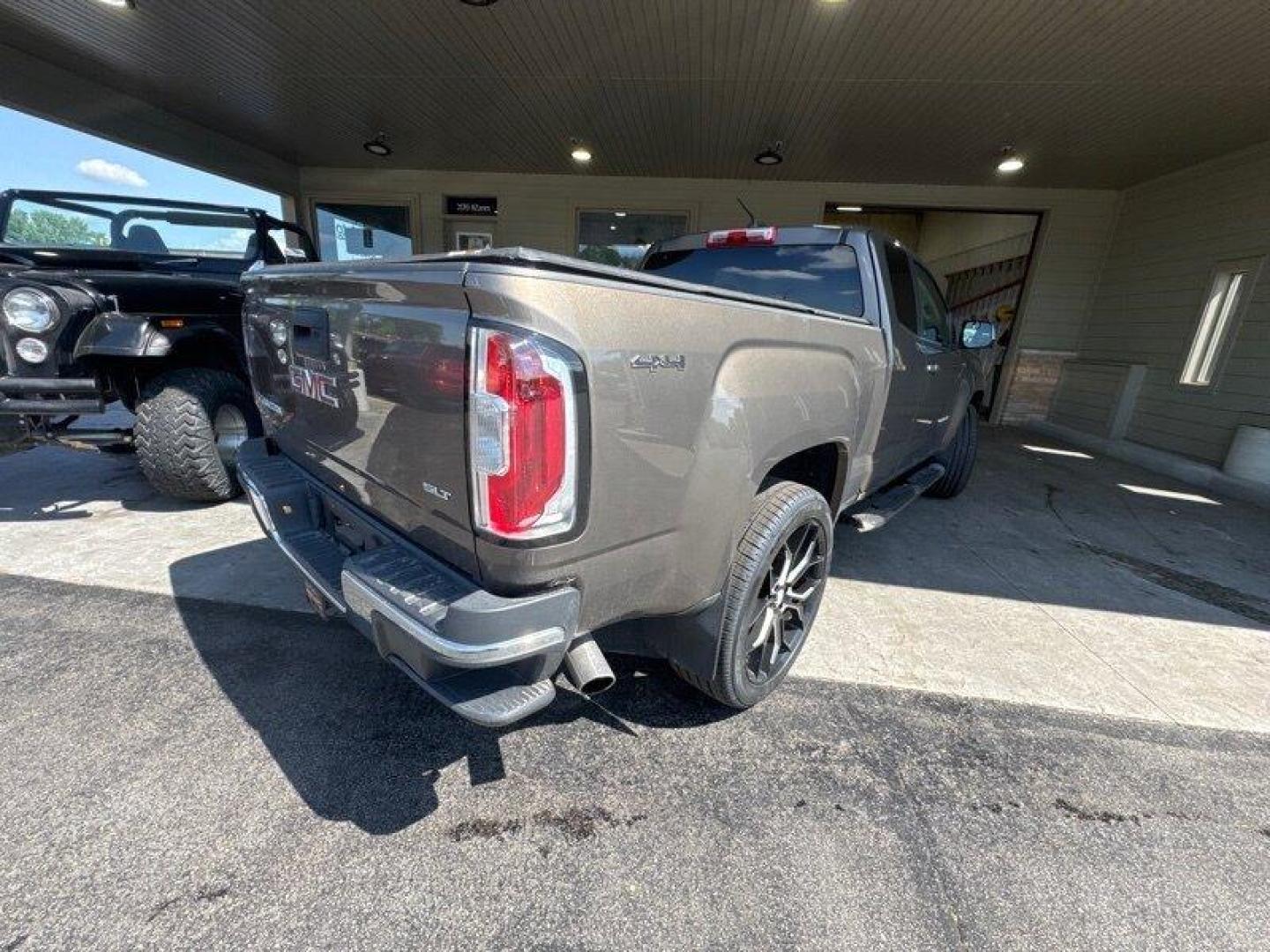 2015 Bronze Alloy Metallic GMC Canyon SLT (1GTH6CE35F1) with an 3.6L V6 305hp 269ft. lbs. engine, Automatic transmission, located at 25355 Eames Street, Channahon, IL, 60410, (815) 467-1807, 41.429108, -88.228432 - Get ready to experience the perfect blend of power and luxury with the 2015 GMC Canyon SLT! This impressive truck is equipped with a robust 3.6L V6 engine that delivers a thrilling 305hp and 269ft. lbs. of torque, ensuring a smooth and exhilarating ride every time you hit the road. The GMC Canyon S - Photo#3