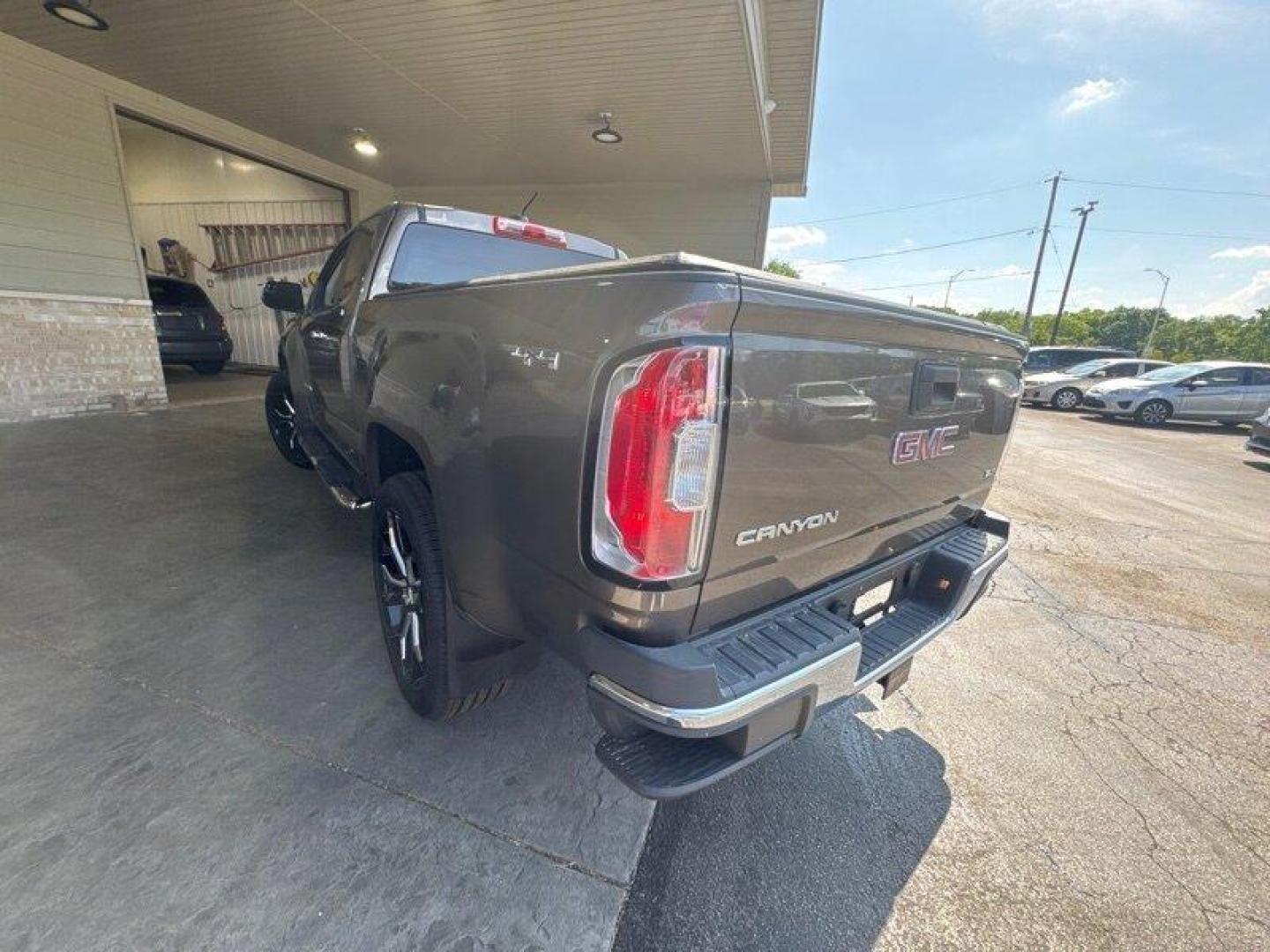 2015 Bronze Alloy Metallic GMC Canyon SLT (1GTH6CE35F1) with an 3.6L V6 305hp 269ft. lbs. engine, Automatic transmission, located at 25355 Eames Street, Channahon, IL, 60410, (815) 467-1807, 41.429108, -88.228432 - Get ready to experience the perfect blend of power and luxury with the 2015 GMC Canyon SLT! This impressive truck is equipped with a robust 3.6L V6 engine that delivers a thrilling 305hp and 269ft. lbs. of torque, ensuring a smooth and exhilarating ride every time you hit the road. The GMC Canyon S - Photo#5
