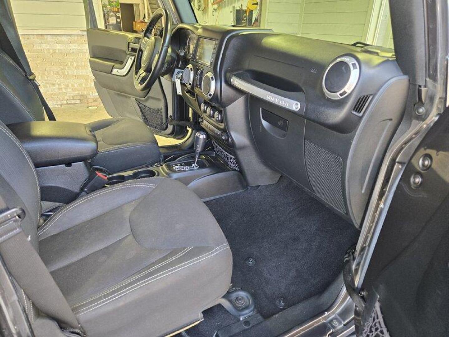 2016 Granite Crystal Metallic Clear Coat Jeep Wrangler Unlimited Sahara (1C4BJWEG3GL) with an 3.6L V6 285hp 260ft. lbs. engine, Automatic transmission, located at 25355 Eames Street, Channahon, IL, 60410, (815) 467-1807, 41.429108, -88.228432 - Introducing the 2016 Jeep Wrangler Unlimited Sahara, a rugged and versatile SUV ready to take on any adventure. Equipped with a powerful 3.6L V6 engine producing 285 horsepower and 260 ft. lbs. of torque, this vehicle offers both performance and capability. Straight from the factory, the 2016 Jeep - Photo#14