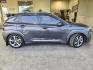 2019 Thunder Gray Hyundai KONA Ultimate (KM8K5CA52KU) with an 1.6L Turbo I4 175hp 195ft. lbs. engine, Automatic transmission, located at 25355 Eames Street, Channahon, IL, 60410, (815) 467-1807, 41.429108, -88.228432 - Introducing the powerhouse on wheels - the 2019 Hyundai KONA Ultimate in Thunder Gray! This beast is equipped with a 1.6L Turbocharged Inline-4 engine, pumping out a jaw-dropping 175 horsepower and 195 ft. lbs. of torque. Dominate the roads with this machine! Step inside the lap of luxury with the - Photo#1