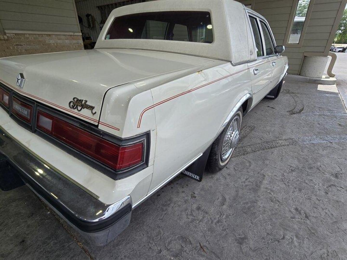 1984 White Chrysler Fifth Avenue (1C3BF66P0EX) with an 5.2L V8 130hp 235ft. lbs. engine, Automatic transmission, located at 25355 Eames Street, Channahon, IL, 60410, (815) 467-1807, 41.429108, -88.228432 - Step back in time with this vintage 1984 Chrysler Fifth Avenue that's as sassy as they come! Powered by a 5.2L V8 engine pumping out 130hp and 235ft. lbs. of torque, this classic beauty is ready to hit the streets with style. Decked out in a sleek White exterior and a bold Red interior, this Fifth - Photo#6
