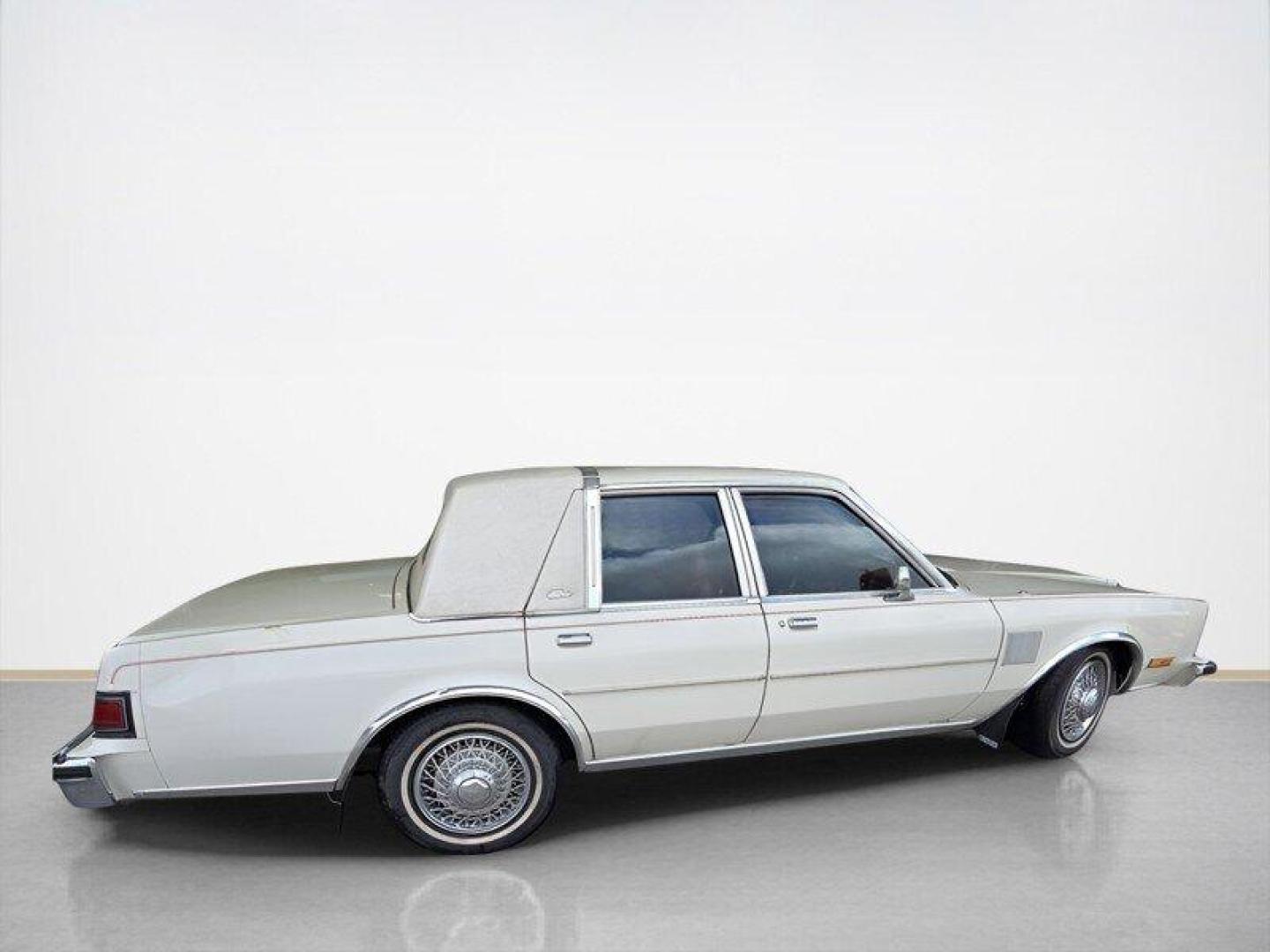 1984 White Chrysler Fifth Avenue (1C3BF66P0EX) with an 5.2L V8 130hp 235ft. lbs. engine, Automatic transmission, located at 25355 Eames Street, Channahon, IL, 60410, (815) 467-1807, 41.429108, -88.228432 - Step back in time with this vintage 1984 Chrysler Fifth Avenue that's as sassy as they come! Powered by a 5.2L V8 engine pumping out 130hp and 235ft. lbs. of torque, this classic beauty is ready to hit the streets with style. Decked out in a sleek White exterior and a bold Red interior, this Fifth - Photo#3