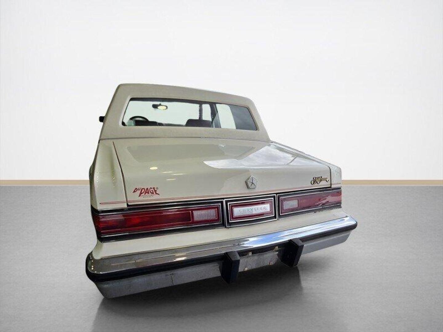 1984 White Chrysler Fifth Avenue (1C3BF66P0EX) with an 5.2L V8 130hp 235ft. lbs. engine, Automatic transmission, located at 25355 Eames Street, Channahon, IL, 60410, (815) 467-1807, 41.429108, -88.228432 - Step back in time with this vintage 1984 Chrysler Fifth Avenue that's as sassy as they come! Powered by a 5.2L V8 engine pumping out 130hp and 235ft. lbs. of torque, this classic beauty is ready to hit the streets with style. Decked out in a sleek White exterior and a bold Red interior, this Fifth - Photo#6