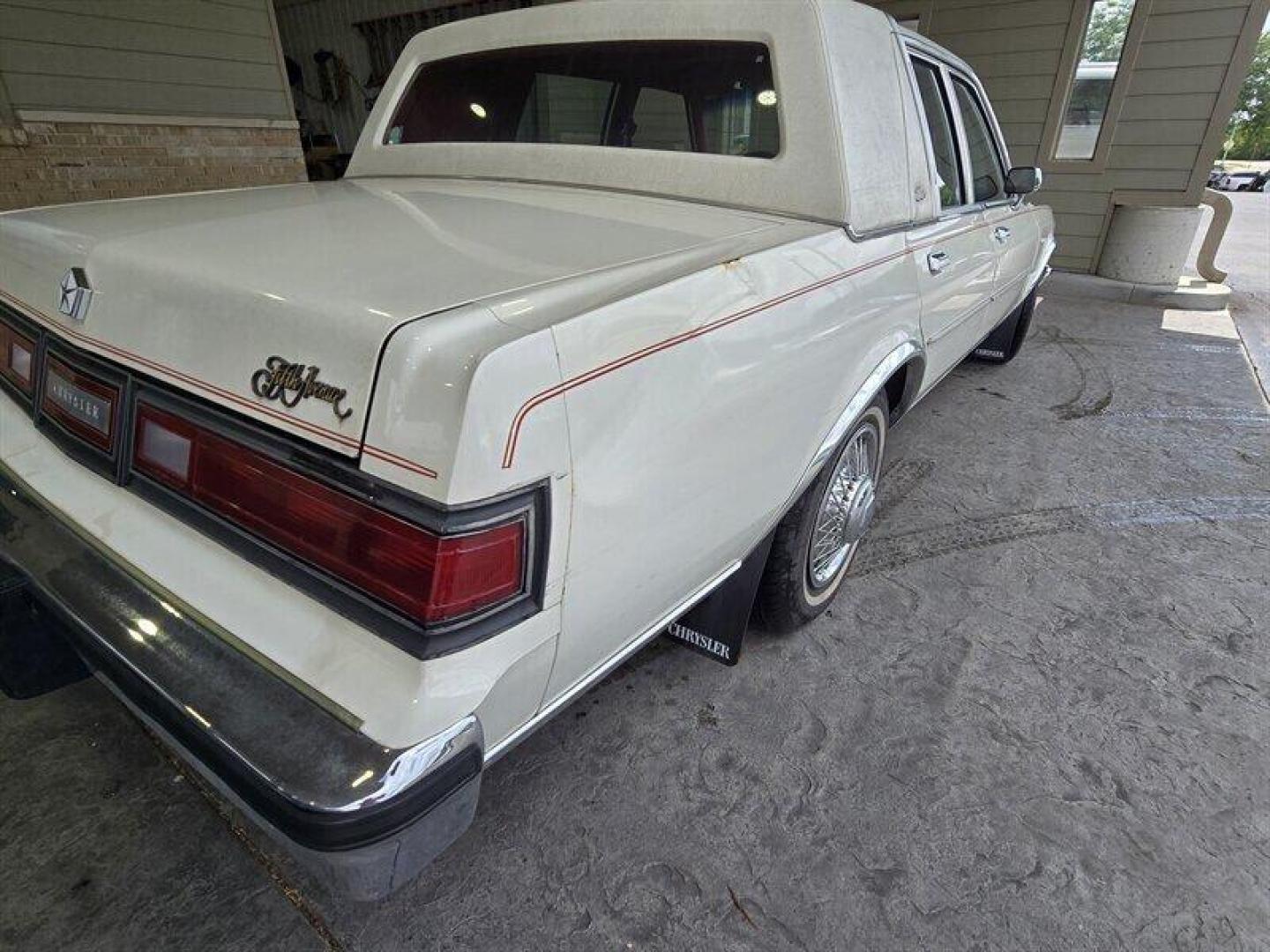 1984 White Chrysler Fifth Avenue (1C3BF66P0EX) with an 5.2L V8 130hp 235ft. lbs. engine, Automatic transmission, located at 25355 Eames Street, Channahon, IL, 60410, (815) 467-1807, 41.429108, -88.228432 - Step back in time with this vintage 1984 Chrysler Fifth Avenue that's as sassy as they come! Powered by a 5.2L V8 engine pumping out 130hp and 235ft. lbs. of torque, this classic beauty is ready to hit the streets with style. Decked out in a sleek White exterior and a bold Red interior, this Fifth - Photo#8