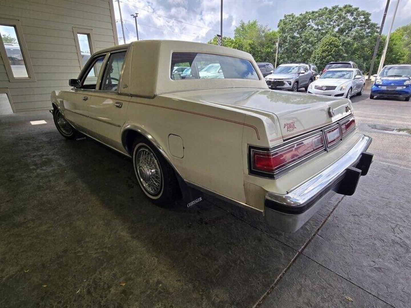 1984 White Chrysler Fifth Avenue (1C3BF66P0EX) with an 5.2L V8 130hp 235ft. lbs. engine, Automatic transmission, located at 25355 Eames Street, Channahon, IL, 60410, (815) 467-1807, 41.429108, -88.228432 - Step back in time with this vintage 1984 Chrysler Fifth Avenue that's as sassy as they come! Powered by a 5.2L V8 engine pumping out 130hp and 235ft. lbs. of torque, this classic beauty is ready to hit the streets with style. Decked out in a sleek White exterior and a bold Red interior, this Fifth - Photo#11