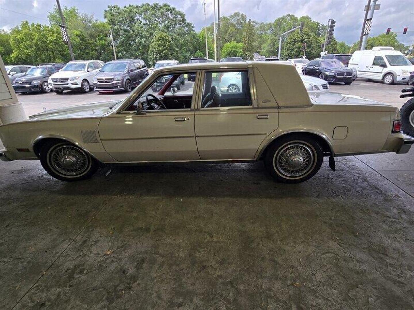 1984 White Chrysler Fifth Avenue (1C3BF66P0EX) with an 5.2L V8 130hp 235ft. lbs. engine, Automatic transmission, located at 25355 Eames Street, Channahon, IL, 60410, (815) 467-1807, 41.429108, -88.228432 - Step back in time with this vintage 1984 Chrysler Fifth Avenue that's as sassy as they come! Powered by a 5.2L V8 engine pumping out 130hp and 235ft. lbs. of torque, this classic beauty is ready to hit the streets with style. Decked out in a sleek White exterior and a bold Red interior, this Fifth - Photo#13