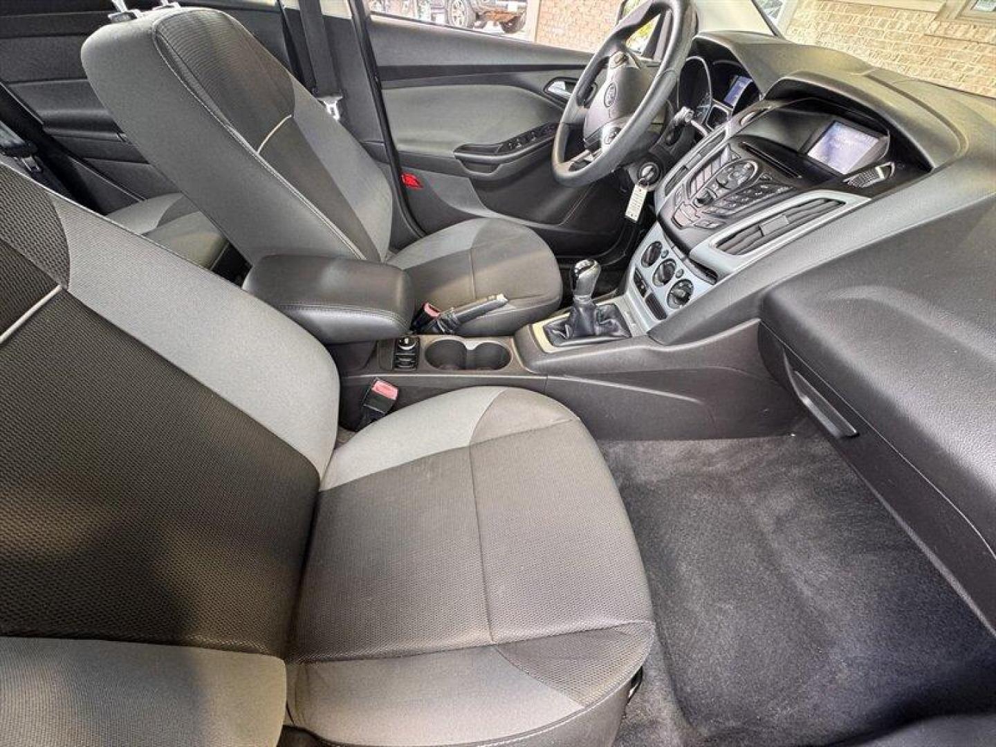 2012 Black Ford Focus SE (1FAHP3K23CL) with an 2.0L I4 160hp 146ft. lbs. engine, 5 Speed Manual transmission, located at 25355 Eames Street, Channahon, IL, 60410, (815) 467-1807, 41.429108, -88.228432 - Introducing the stylish and efficient 2012 Ford Focus SE in the sleek Tuxedo Black Metallic exterior color! This compact car is powered by a reliable 2.0L I4 engine, delivering a peppy 160hp and 146ft. lbs. of torque for a fun driving experience. Step inside the Charcoal Black interior and enjoy th - Photo#11