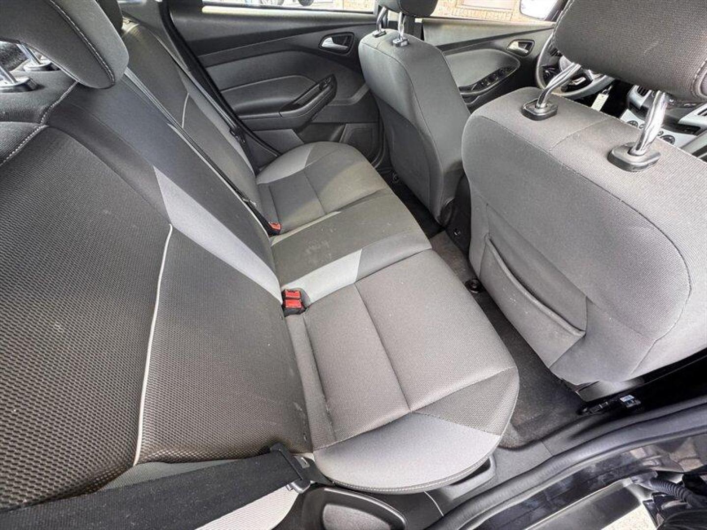 2012 Black Ford Focus SE (1FAHP3K23CL) with an 2.0L I4 160hp 146ft. lbs. engine, 5 Speed Manual transmission, located at 25355 Eames Street, Channahon, IL, 60410, (815) 467-1807, 41.429108, -88.228432 - Introducing the stylish and efficient 2012 Ford Focus SE in the sleek Tuxedo Black Metallic exterior color! This compact car is powered by a reliable 2.0L I4 engine, delivering a peppy 160hp and 146ft. lbs. of torque for a fun driving experience. Step inside the Charcoal Black interior and enjoy th - Photo#12