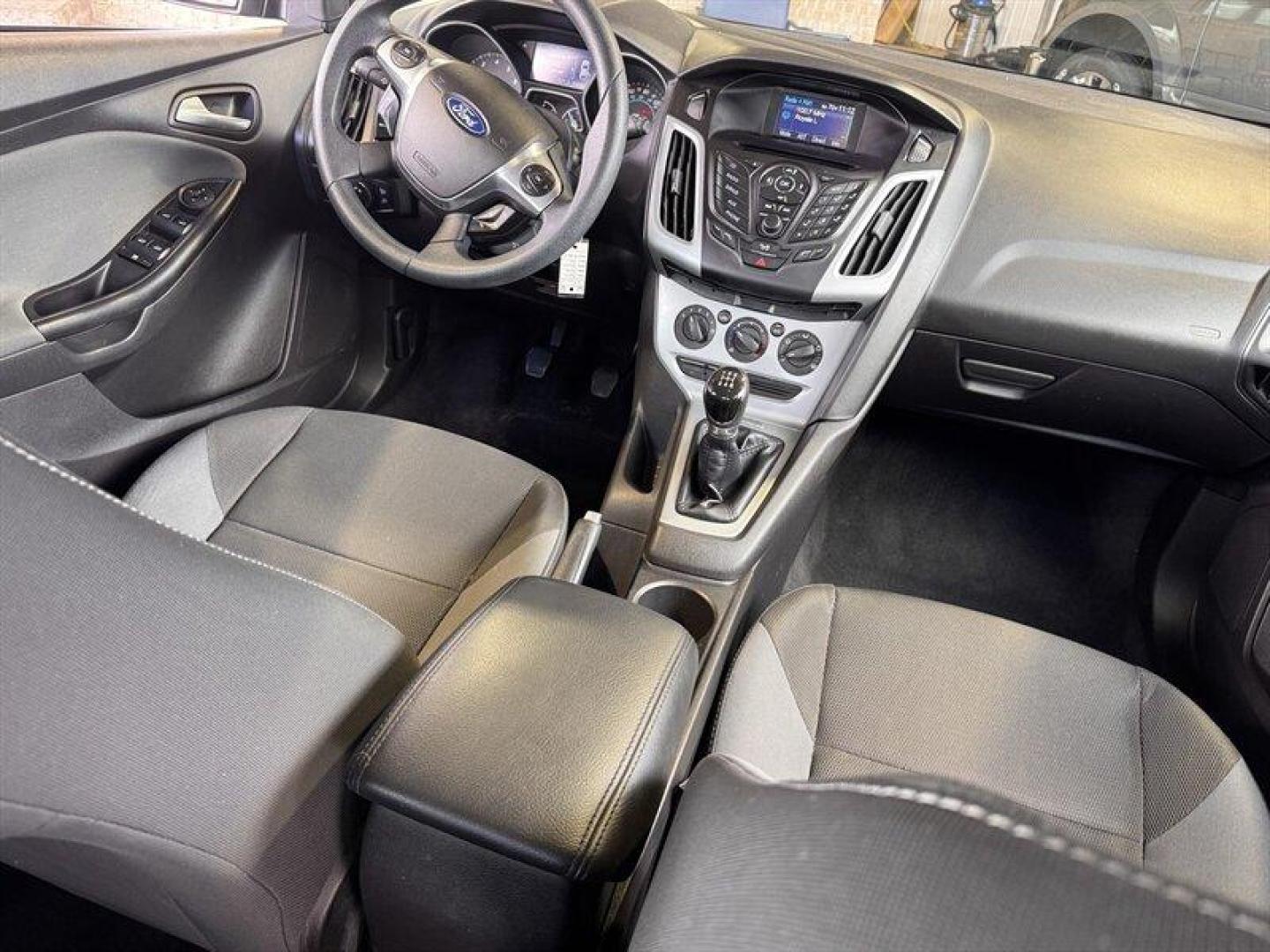2012 Black Ford Focus SE (1FAHP3K23CL) with an 2.0L I4 160hp 146ft. lbs. engine, 5 Speed Manual transmission, located at 25355 Eames Street, Channahon, IL, 60410, (815) 467-1807, 41.429108, -88.228432 - Introducing the stylish and efficient 2012 Ford Focus SE in the sleek Tuxedo Black Metallic exterior color! This compact car is powered by a reliable 2.0L I4 engine, delivering a peppy 160hp and 146ft. lbs. of torque for a fun driving experience. Step inside the Charcoal Black interior and enjoy th - Photo#13