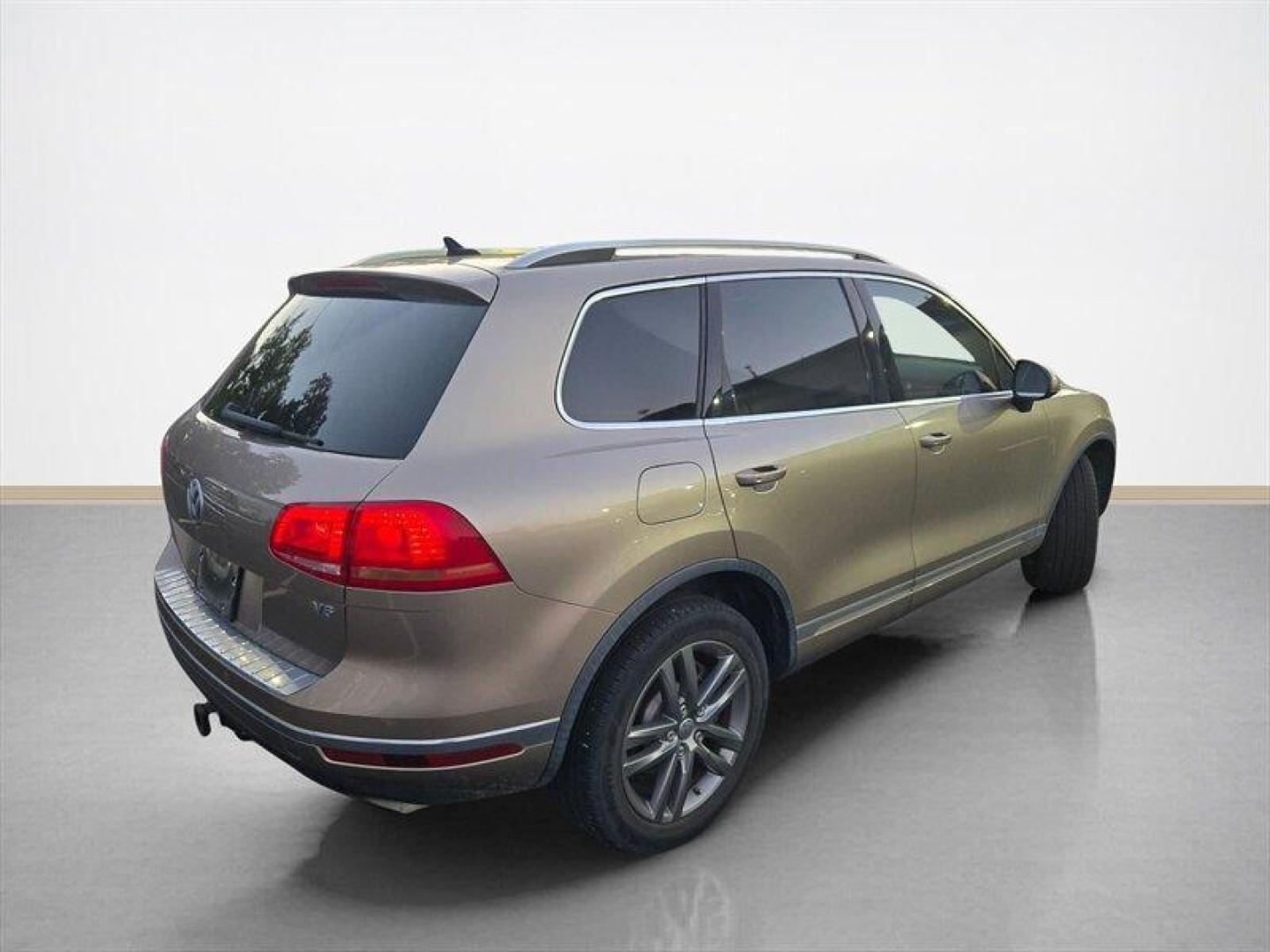 2016 Tan Volkswagen Touareg VR6 FSI Lux (WVGEF9BP1GD) with an 3.6L V6 280hp 266ft. lbs. engine, TipTronic transmission, located at 25355 Eames Street, Channahon, IL, 60410, (815) 467-1807, 41.429108, -88.228432 - ** LOCAL TRADE IN, WHOLESALE AS-IS SPECIAL, HAS OIL LEAKS AND NEEDS FUEL GUAGE SENSOR. ** Step into luxury with this 2016 Volkswagen Touareg VR6 FSI Lux. Powered by a robust 3.6L V6 engine delivering 280hp and 266ft. lbs. of torque, this SUV is ready to take on any adventure. The exterior features a - Photo#3