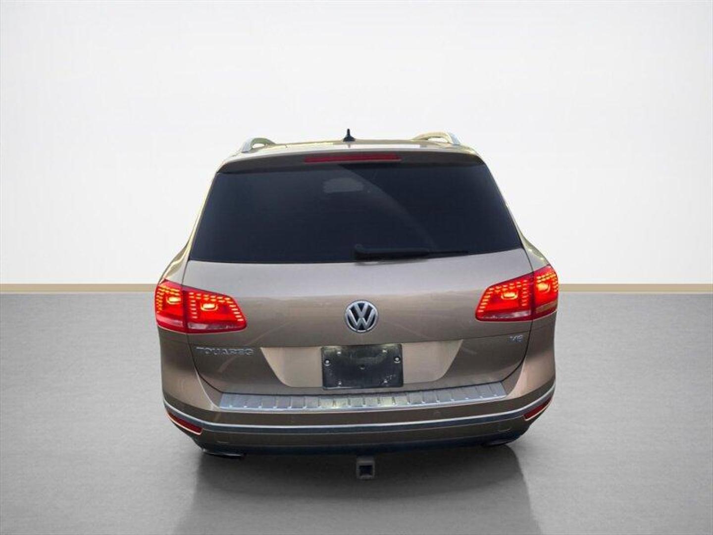 2016 Tan Volkswagen Touareg VR6 FSI Lux (WVGEF9BP1GD) with an 3.6L V6 280hp 266ft. lbs. engine, TipTronic transmission, located at 25355 Eames Street, Channahon, IL, 60410, (815) 467-1807, 41.429108, -88.228432 - ** LOCAL TRADE IN, WHOLESALE AS-IS SPECIAL, HAS OIL LEAKS AND NEEDS FUEL GUAGE SENSOR. ** Step into luxury with this 2016 Volkswagen Touareg VR6 FSI Lux. Powered by a robust 3.6L V6 engine delivering 280hp and 266ft. lbs. of torque, this SUV is ready to take on any adventure. The exterior features a - Photo#4