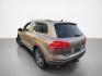2016 Tan Volkswagen Touareg VR6 FSI Lux (WVGEF9BP1GD) with an 3.6L V6 280hp 266ft. lbs. engine, TipTronic transmission, located at 25355 Eames Street, Channahon, IL, 60410, (815) 467-1807, 41.429108, -88.228432 - ** LOCAL TRADE IN, WHOLESALE AS-IS SPECIAL, HAS OIL LEAKS AND NEEDS FUEL GUAGE SENSOR. ** Step into luxury with this 2016 Volkswagen Touareg VR6 FSI Lux. Powered by a robust 3.6L V6 engine delivering 280hp and 266ft. lbs. of torque, this SUV is ready to take on any adventure. The exterior features a - Photo#5