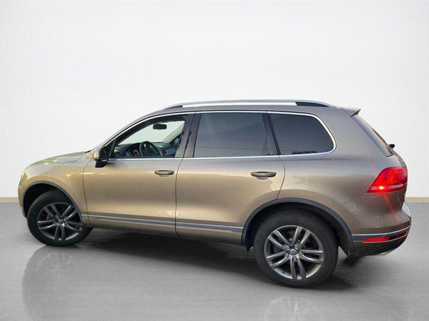 2016 Tan Volkswagen Touareg VR6 FSI Lux (WVGEF9BP1GD) with an 3.6L V6 280hp 266ft. lbs. engine, TipTronic transmission, located at 25355 Eames Street, Channahon, IL, 60410, (815) 467-1807, 41.429108, -88.228432 - ** LOCAL TRADE IN, WHOLESALE AS-IS SPECIAL, HAS OIL LEAKS AND NEEDS FUEL GUAGE SENSOR. ** Step into luxury with this 2016 Volkswagen Touareg VR6 FSI Lux. Powered by a robust 3.6L V6 engine delivering 280hp and 266ft. lbs. of torque, this SUV is ready to take on any adventure. The exterior features a - Photo#6