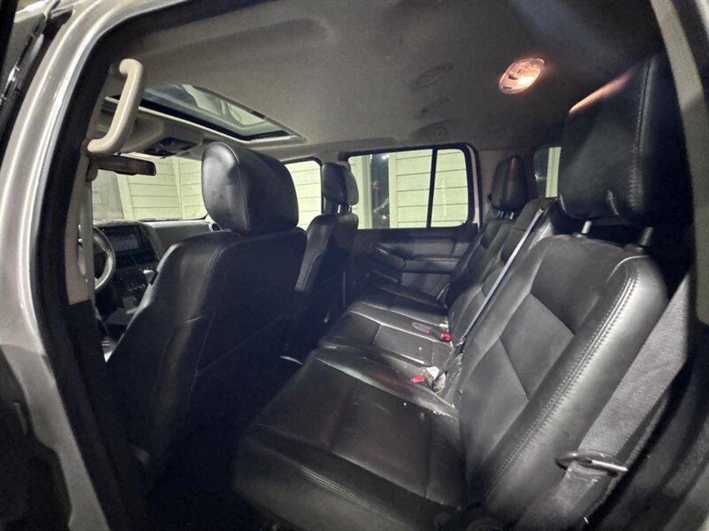 2007 Silver Ford Explorer Limited (1FMEU75817U) with an 4.6L V8 292hp 300ft. lbs. engine, Automatic transmission, located at 25355 Eames Street, Channahon, IL, 60410, (815) 467-1807, 41.429108, -88.228432 - This 2007 Ford Explorer Limited 4x4 is a local trade powered by the V8, offering solid capability and room for the whole crew. It comes equipped with heated leather seats, a sunroof, and 7-passenger seating, making it a well-optioned SUV for its age. Please note: this vehicle is being sold as-is, a - Photo#12