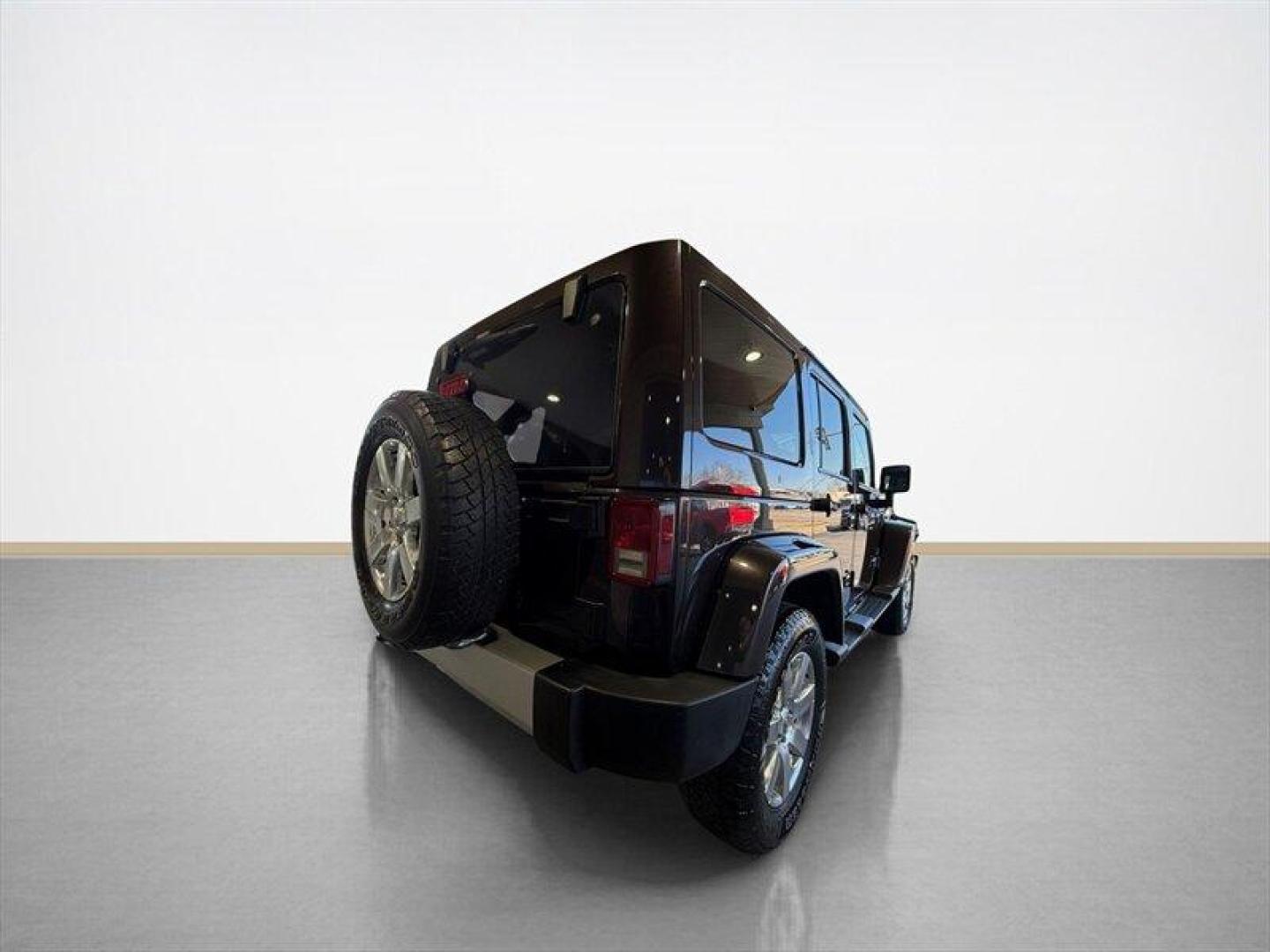 2013 Rugged Brown Pearl Coat Jeep Wrangler Unlimited Sahara (1C4HJWEG9DL) with an 3.6L V6 285hp 260ft. lbs. engine, Automatic transmission, located at 25355 Eames Street, Channahon, IL, 60410, (815) 467-1807, 41.429108, -88.228432 - Meet your next adventure buddy: a 2013 Jeep Wrangler Unlimited Sahara with the thirsty-for-fun 3.6L V6 (285 hp, 260 lb-ft). This is the four-door Wrangler that says weekend warrior loud and proud and yes, it actually looks as good in mud as it does in the city. Whats special here: - Dual Top Group - Photo#3