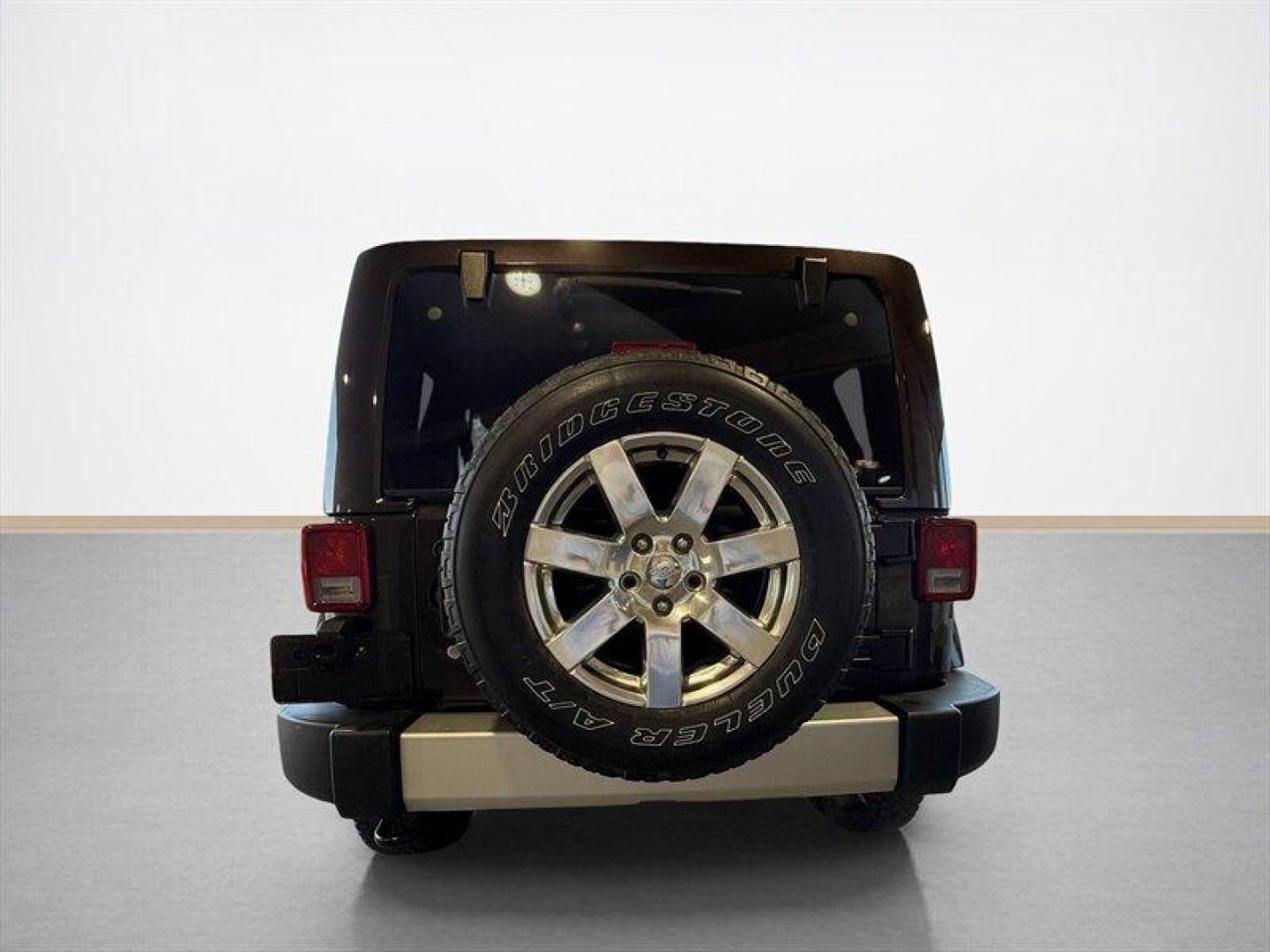 2013 Rugged Brown Pearl Coat Jeep Wrangler Unlimited Sahara (1C4HJWEG9DL) with an 3.6L V6 285hp 260ft. lbs. engine, Automatic transmission, located at 25355 Eames Street, Channahon, IL, 60410, (815) 467-1807, 41.429108, -88.228432 - Meet your next adventure buddy: a 2013 Jeep Wrangler Unlimited Sahara with the thirsty-for-fun 3.6L V6 (285 hp, 260 lb-ft). This is the four-door Wrangler that says weekend warrior loud and proud and yes, it actually looks as good in mud as it does in the city. Whats special here: - Dual Top Group - Photo#4