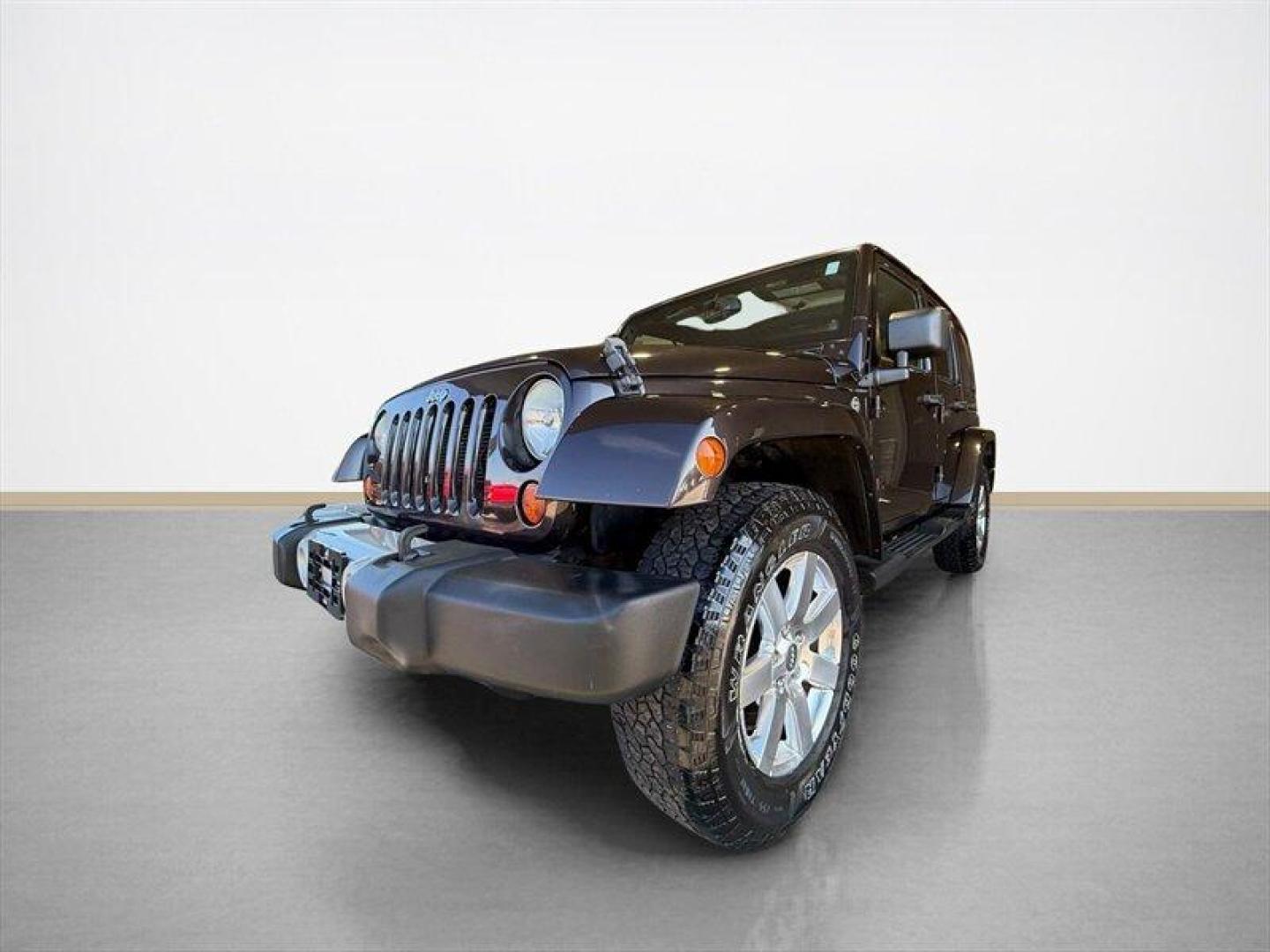 2013 Rugged Brown Pearl Coat Jeep Wrangler Unlimited Sahara (1C4HJWEG9DL) with an 3.6L V6 285hp 260ft. lbs. engine, Automatic transmission, located at 25355 Eames Street, Channahon, IL, 60410, (815) 467-1807, 41.429108, -88.228432 - Meet your next adventure buddy: a 2013 Jeep Wrangler Unlimited Sahara with the thirsty-for-fun 3.6L V6 (285 hp, 260 lb-ft). This is the four-door Wrangler that says weekend warrior loud and proud and yes, it actually looks as good in mud as it does in the city. Whats special here: - Dual Top Group - Photo#7