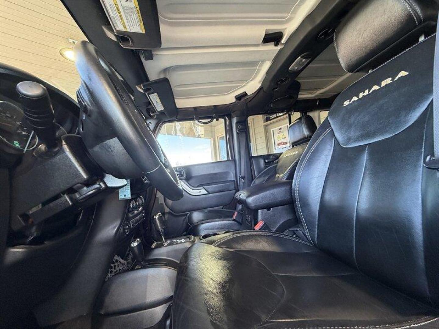 2013 Rugged Brown Pearl Coat Jeep Wrangler Unlimited Sahara (1C4HJWEG9DL) with an 3.6L V6 285hp 260ft. lbs. engine, Automatic transmission, located at 25355 Eames Street, Channahon, IL, 60410, (815) 467-1807, 41.429108, -88.228432 - Meet your next adventure buddy: a 2013 Jeep Wrangler Unlimited Sahara with the thirsty-for-fun 3.6L V6 (285 hp, 260 lb-ft). This is the four-door Wrangler that says weekend warrior loud and proud and yes, it actually looks as good in mud as it does in the city. Whats special here: - Dual Top Group - Photo#10