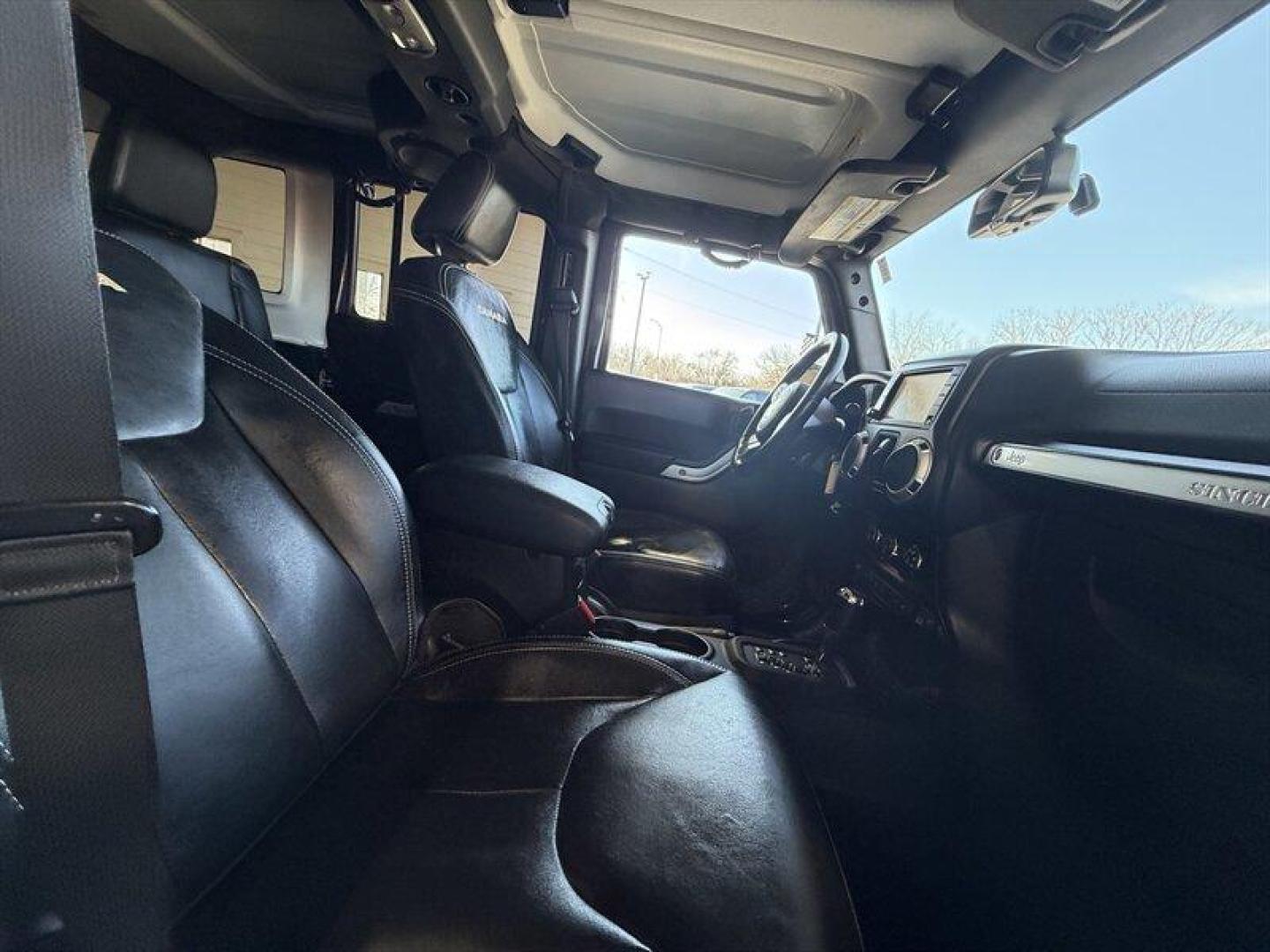 2013 Rugged Brown Pearl Coat Jeep Wrangler Unlimited Sahara (1C4HJWEG9DL) with an 3.6L V6 285hp 260ft. lbs. engine, Automatic transmission, located at 25355 Eames Street, Channahon, IL, 60410, (815) 467-1807, 41.429108, -88.228432 - Meet your next adventure buddy: a 2013 Jeep Wrangler Unlimited Sahara with the thirsty-for-fun 3.6L V6 (285 hp, 260 lb-ft). This is the four-door Wrangler that says weekend warrior loud and proud and yes, it actually looks as good in mud as it does in the city. Whats special here: - Dual Top Group - Photo#13