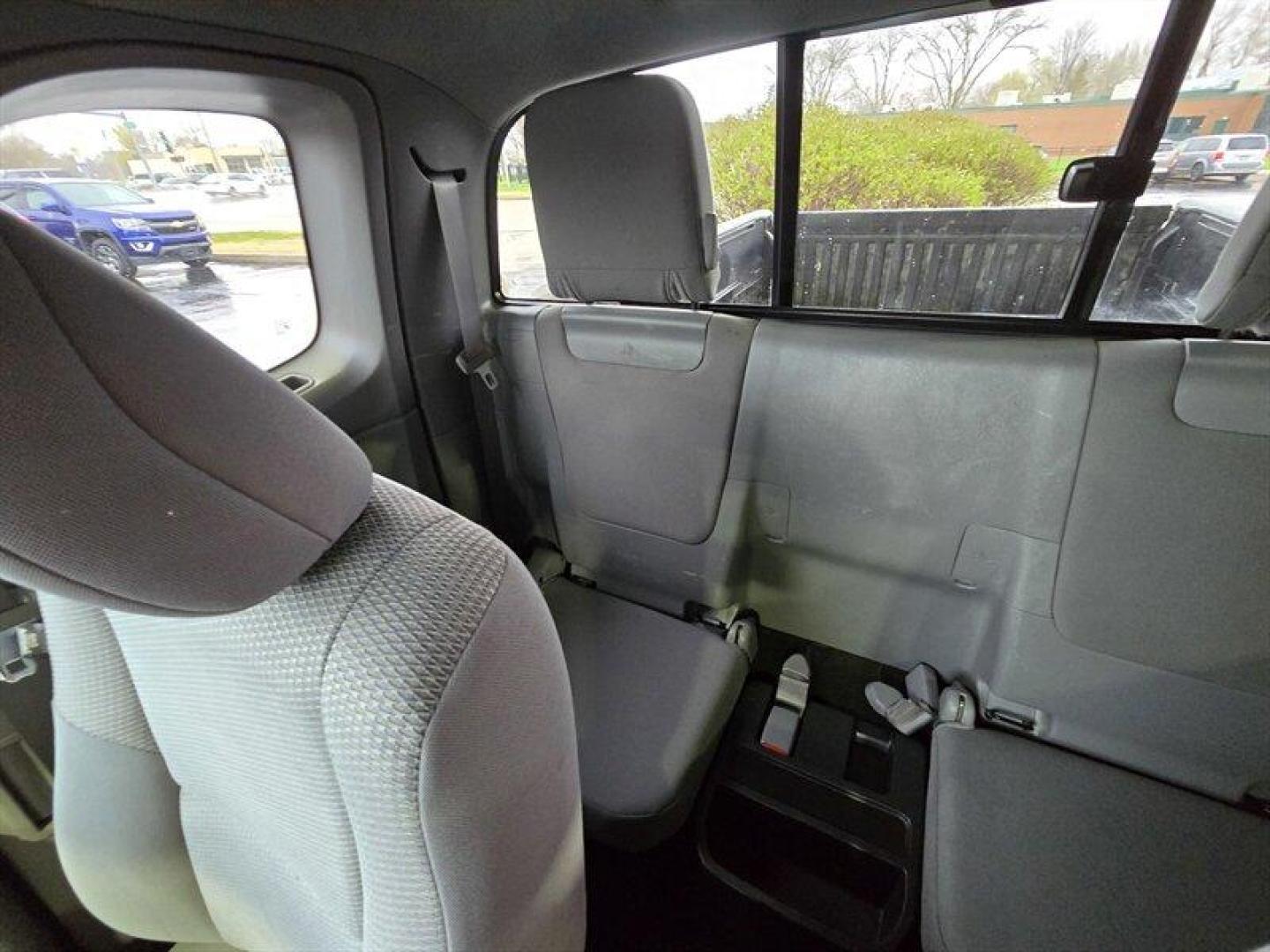 2015 Super White Toyota Tacoma (5TFUX4EN8FX) with an 2.7L I4 159hp 180ft. lbs. engine, Automatic transmission, located at 25355 Eames Street, Channahon, IL, 60410, (815) 467-1807, 41.429108, -88.228432 - This 2015 Toyota Tacoma is built to take over the road no apologies. Super White exterior, Graphite interior, and a gutsy 2.7L I4 pumping out 159 horsepower and 180 lb-ft of torque. Its lean, its mean, and itll get you where you need to go with a measured appetite: 18 MPG city and 20 MPG highway. T - Photo#20