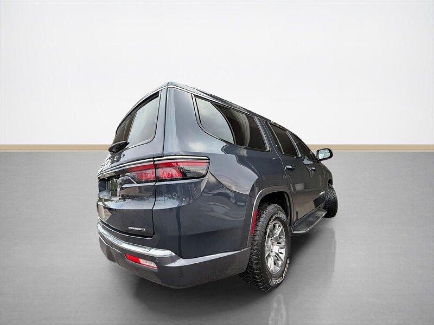 2022 Baltic Gray Metallic Clear Coat Jeep Wagoneer Series I (1C4SJVAT9NS) with an HEMI eTorque 5.7L Mild Hybrid V8 392hp 404ft. lbs. engine, Automatic transmission, located at 25355 Eames Street, Channahon, IL, 60410, (815) 467-1807, 41.429108, -88.228432 - Behold a modern American icon reborn: the 2022 Jeep Wagoneer Series I, cloaked in the sublime River Rock exterior and appointed in refined Global Black leather. Powered by the commanding HEMI eTorque 5.7L Mild Hybrid V8 delivering a muscular 392 horsepower and 404 lb-ft of torque this flagship-cal - Photo#3