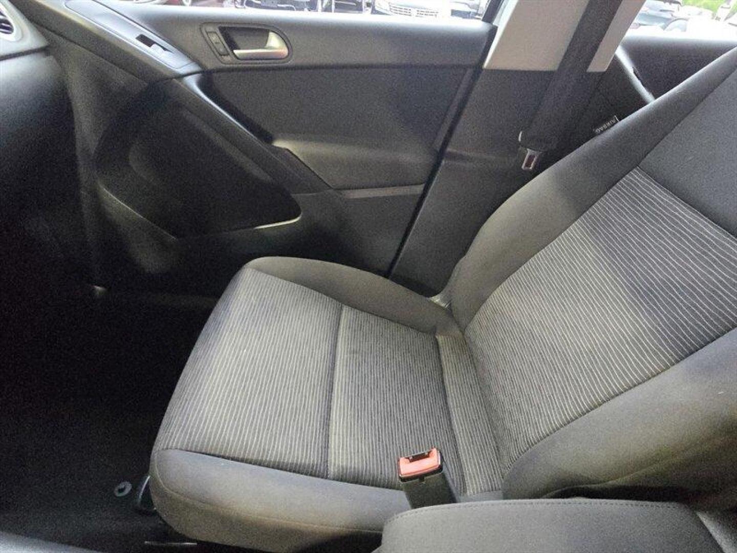 2014 Deep Black Metallic Volkswagen Tiguan S (WVGCV3AXXEW) with an 2.0L Turbo I4 200hp 207ft. lbs. engine, 6 Speed Manual transmission, located at 25355 Eames Street, Channahon, IL, 60410, (815) 467-1807, 41.429108, -88.228432 - ** HARD TO FIND 6-SPEED MANUAL ** 2014 Volkswagen Tiguan S Deep Black Metallic exterior with Black cloth interior. Powered by a 2.0L turbocharged inline-4 producing 200 hp and 207 lb-ft of torque, this Tiguan delivers confident acceleration and everyday driving flexibility. It has under 92,000 mile - Photo#20
