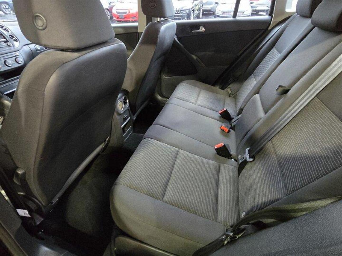 2014 Deep Black Metallic Volkswagen Tiguan S (WVGCV3AXXEW) with an 2.0L Turbo I4 200hp 207ft. lbs. engine, 6 Speed Manual transmission, located at 25355 Eames Street, Channahon, IL, 60410, (815) 467-1807, 41.429108, -88.228432 - ** HARD TO FIND 6-SPEED MANUAL ** 2014 Volkswagen Tiguan S Deep Black Metallic exterior with Black cloth interior. Powered by a 2.0L turbocharged inline-4 producing 200 hp and 207 lb-ft of torque, this Tiguan delivers confident acceleration and everyday driving flexibility. It has under 92,000 mile - Photo#22