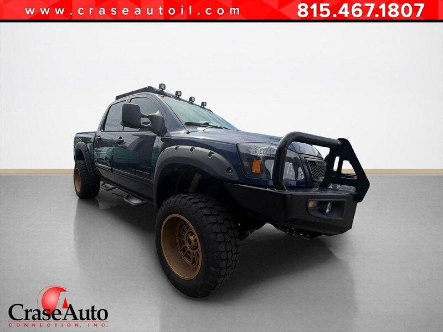 2010 Navy Blue Nissan Titan PRO-4X (1N6BA0EC7AN) with an 5.6L Flex Fuel V8 317hp 385ft. lbs. engine, Automatic transmission, located at 25355 Eames Street, Channahon, IL, 60410, (815) 467-1807, 41.429108, -88.228432 - Meet your next project with personality this 2010 Nissan Titan PRO-4X. And lets just get one thing straight right out the gate she is NOT a delicate little garage-kept princess. Shes more like that wild friend whos got stories, a little attitude, and absolutely zero apologies. This is a Texas truc - Photo#0