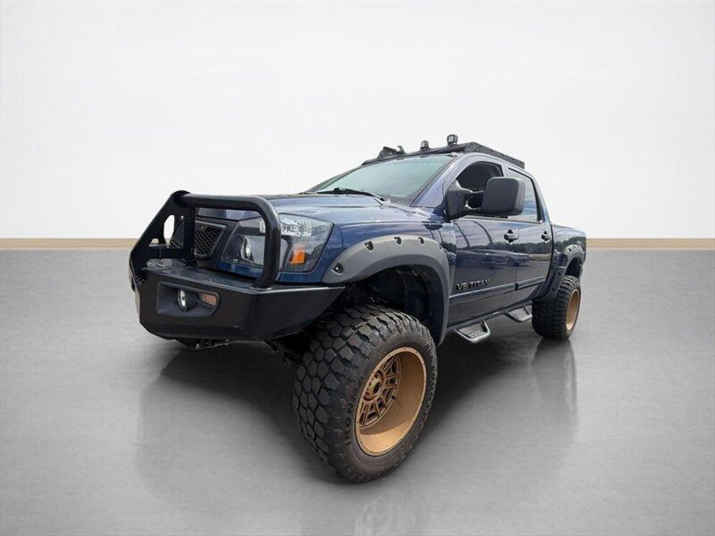 2010 Navy Blue Nissan Titan PRO-4X (1N6BA0EC7AN) with an 5.6L Flex Fuel V8 317hp 385ft. lbs. engine, Automatic transmission, located at 25355 Eames Street, Channahon, IL, 60410, (815) 467-1807, 41.429108, -88.228432 - Meet your next project with personality this 2010 Nissan Titan PRO-4X. And lets just get one thing straight right out the gate she is NOT a delicate little garage-kept princess. Shes more like that wild friend whos got stories, a little attitude, and absolutely zero apologies. This is a Texas truc - Photo#7