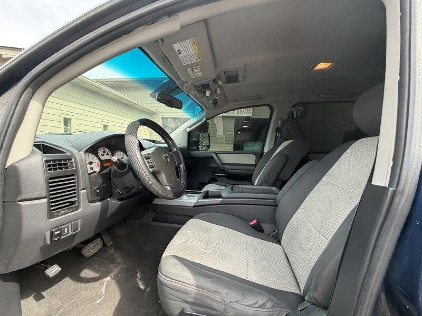 2010 Navy Blue Nissan Titan PRO-4X (1N6BA0EC7AN) with an 5.6L Flex Fuel V8 317hp 385ft. lbs. engine, Automatic transmission, located at 25355 Eames Street, Channahon, IL, 60410, (815) 467-1807, 41.429108, -88.228432 - Meet your next project with personality this 2010 Nissan Titan PRO-4X. And lets just get one thing straight right out the gate she is NOT a delicate little garage-kept princess. Shes more like that wild friend whos got stories, a little attitude, and absolutely zero apologies. This is a Texas truc - Photo#11