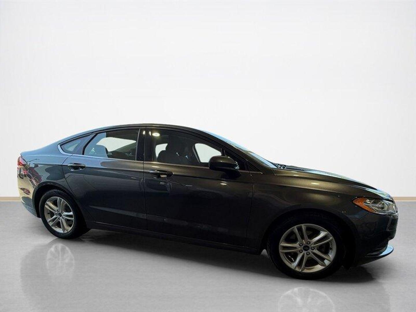 2018 Magnetic Ford Fusion SE (3FA6P0HD8JR) with an EcoBoost 1.5L Turbo I4 181hp 185ft. lbs. engine, Automatic transmission, located at 25355 Eames Street, Channahon, IL, 60410, (815) 467-1807, 41.429108, -88.228432 - Clean local trade with only 65,000 miles and ready to save you money at the pump without sacrificing style. Smooth ride, sharp looks, and the kind of sedan that still turns heads in a parking lot. Perfect daily driver energy with comfort, reliability, and great MPG all wrapped into one sleek packag - Photo#1