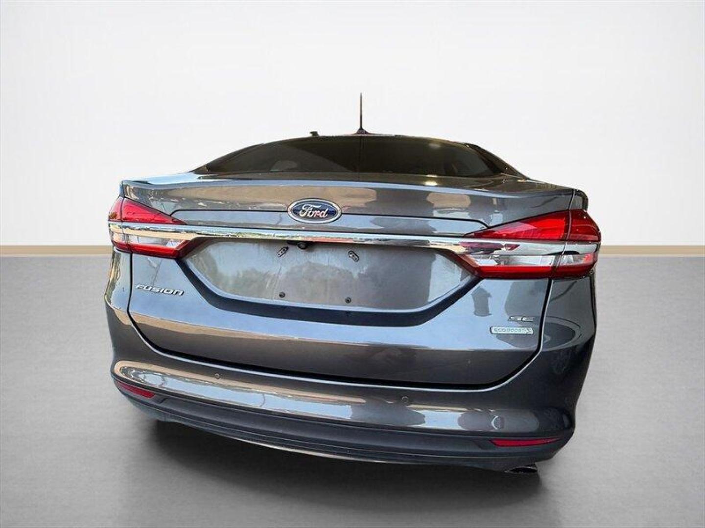 2018 Magnetic Ford Fusion SE (3FA6P0HD8JR) with an EcoBoost 1.5L Turbo I4 181hp 185ft. lbs. engine, Automatic transmission, located at 25355 Eames Street, Channahon, IL, 60410, (815) 467-1807, 41.429108, -88.228432 - Clean local trade with only 65,000 miles and ready to save you money at the pump without sacrificing style. Smooth ride, sharp looks, and the kind of sedan that still turns heads in a parking lot. Perfect daily driver energy with comfort, reliability, and great MPG all wrapped into one sleek packag - Photo#4