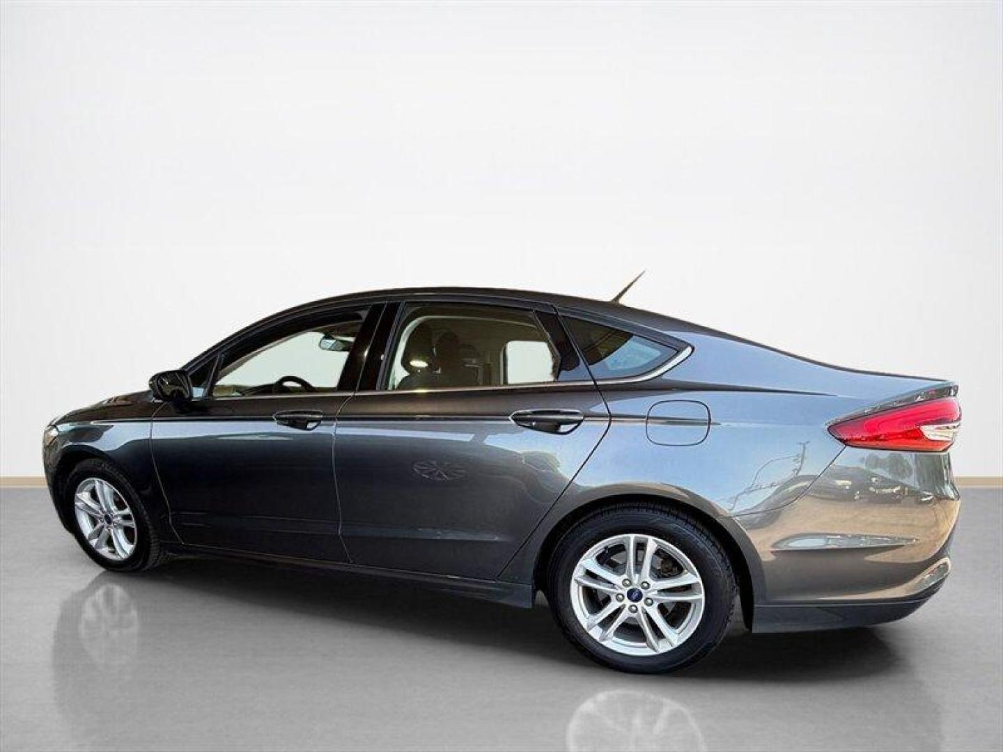 2018 Magnetic Ford Fusion SE (3FA6P0HD8JR) with an EcoBoost 1.5L Turbo I4 181hp 185ft. lbs. engine, Automatic transmission, located at 25355 Eames Street, Channahon, IL, 60410, (815) 467-1807, 41.429108, -88.228432 - Clean local trade with only 65,000 miles and ready to save you money at the pump without sacrificing style. Smooth ride, sharp looks, and the kind of sedan that still turns heads in a parking lot. Perfect daily driver energy with comfort, reliability, and great MPG all wrapped into one sleek packag - Photo#6