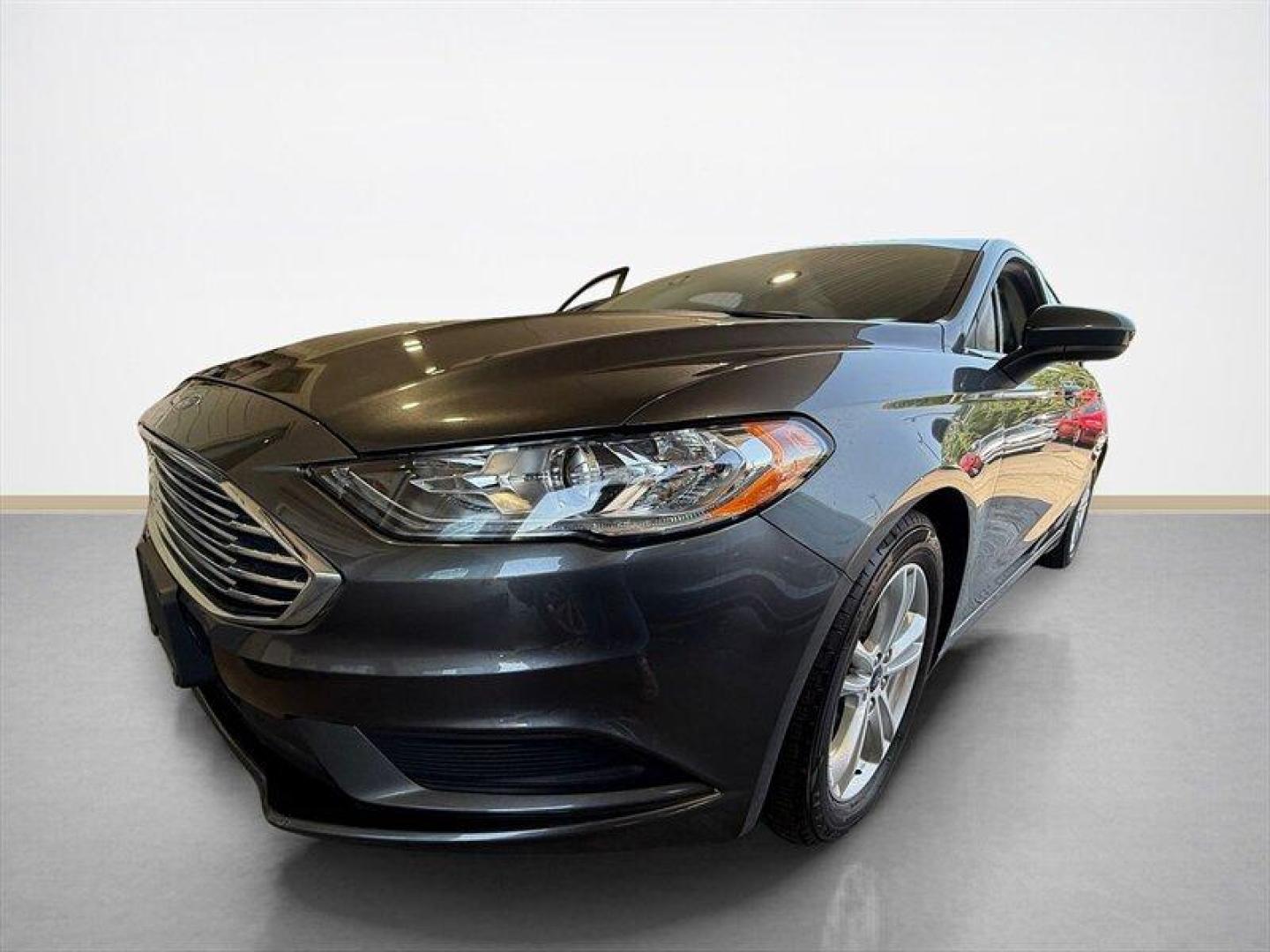 2018 Magnetic Ford Fusion SE (3FA6P0HD8JR) with an EcoBoost 1.5L Turbo I4 181hp 185ft. lbs. engine, Automatic transmission, located at 25355 Eames Street, Channahon, IL, 60410, (815) 467-1807, 41.429108, -88.228432 - Clean local trade with only 65,000 miles and ready to save you money at the pump without sacrificing style. Smooth ride, sharp looks, and the kind of sedan that still turns heads in a parking lot. Perfect daily driver energy with comfort, reliability, and great MPG all wrapped into one sleek packag - Photo#7