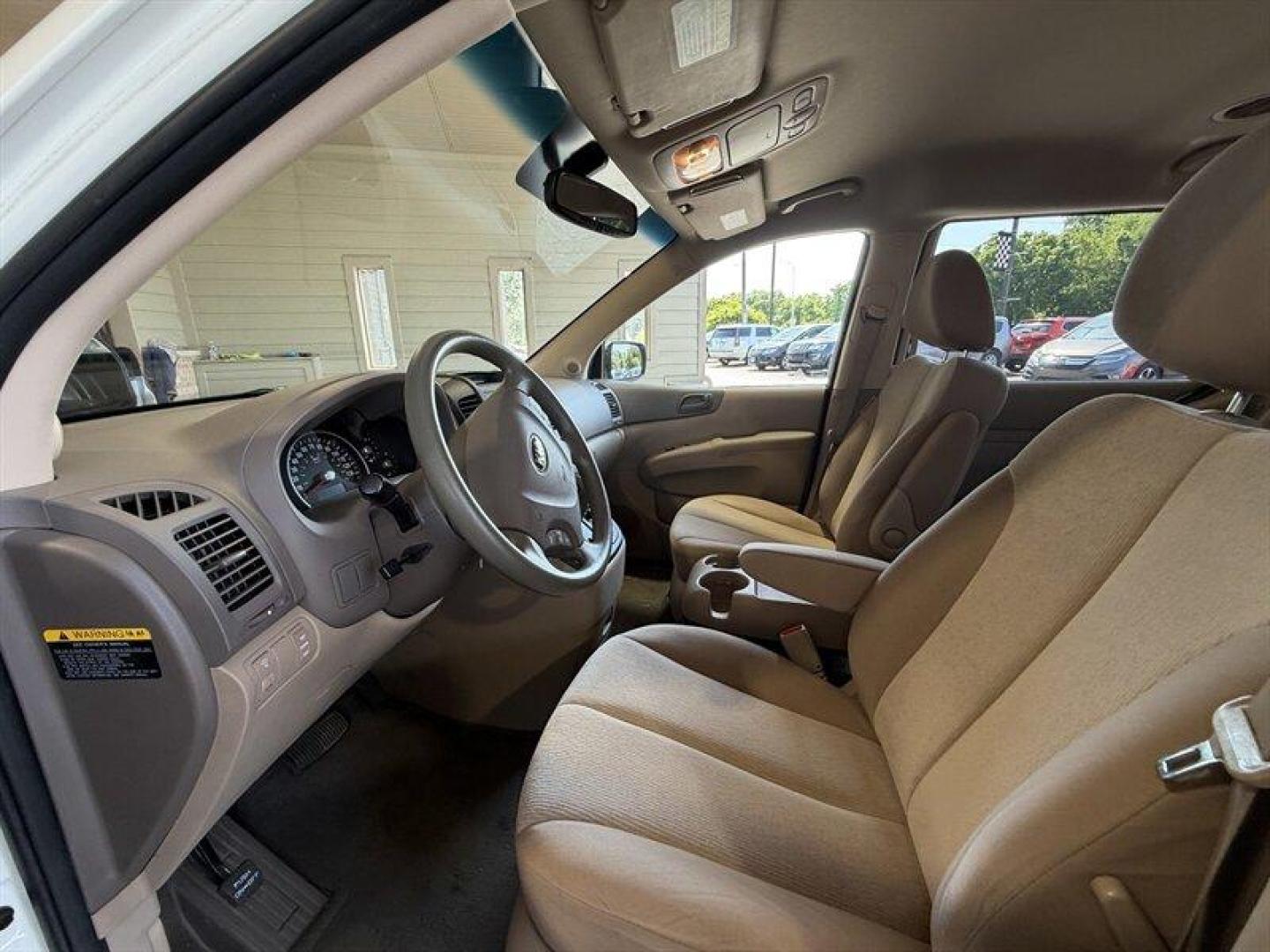 2012 Clear White Kia Sedona LX (KNDMG4C70C6) with an 3.5 engine, Automatic transmission, located at 25355 Eames Street, Channahon, IL, 60410, (815) 467-1807, 41.429108, -88.228432 - The kind of van that says Ive been babied, not battled. One-owner, low-mile, local trade owned by an older couple its whole life this Sedona has lived the easy life. Power doors, backup camera, bucket seats, and plenty of room for kids, groceries, road trips, or whatever chaos life throws in the b - Photo#10