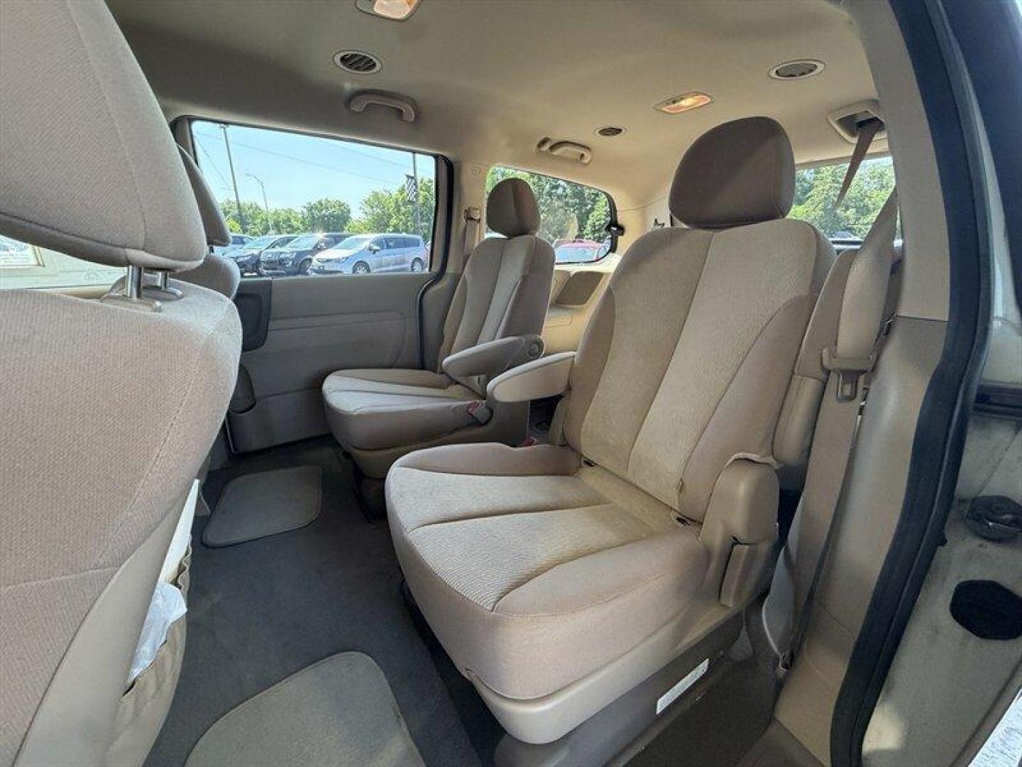 2012 Clear White Kia Sedona LX (KNDMG4C70C6) with an 3.5 engine, Automatic transmission, located at 25355 Eames Street, Channahon, IL, 60410, (815) 467-1807, 41.429108, -88.228432 - The kind of van that says Ive been babied, not battled. One-owner, low-mile, local trade owned by an older couple its whole life this Sedona has lived the easy life. Power doors, backup camera, bucket seats, and plenty of room for kids, groceries, road trips, or whatever chaos life throws in the b - Photo#11