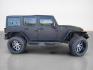 2014 Black Clear Coat Jeep Wrangler Unlimited Sport (1C4HJWDG5EL) with an 3.6L V6 285hp 260ft. lbs. engine, Automatic transmission, located at 25355 Eames Street, Channahon, IL, 60410, (815) 467-1807, 41.429108, -88.228432 - ** STARWOOD MOTORS CONVERSION, WHOLE TRUCK IS RHINO LINED THAT ALONE WAS $12,000, ALSO HAS A TERAFLEX SUSPENSION LIFT, WARN WINCH, OFFROAD BUMPERS, LIGHTS EVERYWHERE INCLUDING IN THE WHEELWELLS AND UNDERNEATH. ** OVER $20,000 TO BUILD. The 2014 Jeep Wrangler Unlimited Sport is equipped with a robust - Photo#1