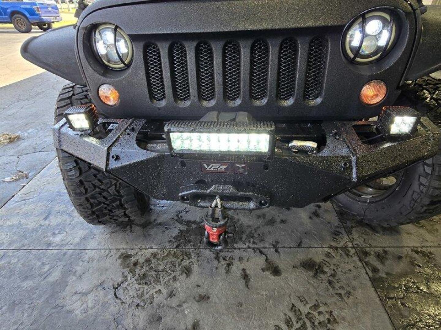 2014 Black Clear Coat Jeep Wrangler Unlimited Sport (1C4HJWDG5EL) with an 3.6L V6 285hp 260ft. lbs. engine, Automatic transmission, located at 25355 Eames Street, Channahon, IL, 60410, (815) 467-1807, 41.429108, -88.228432 - ** STARWOOD MOTORS CONVERSION, WHOLE TRUCK IS RHINO LINED THAT ALONE WAS $12,000, ALSO HAS A TERAFLEX SUSPENSION LIFT, WARN WINCH, OFFROAD BUMPERS, LIGHTS EVERYWHERE INCLUDING IN THE WHEELWELLS AND UNDERNEATH. ** OVER $20,000 TO BUILD. The 2014 Jeep Wrangler Unlimited Sport is equipped with a robust - Photo#9