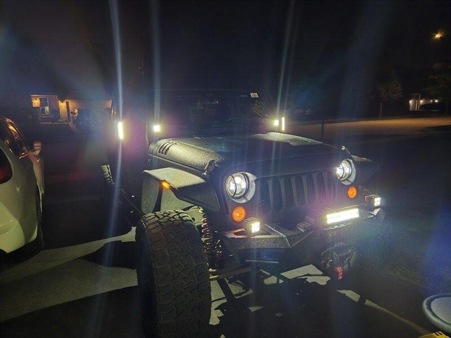 2014 Black Clear Coat Jeep Wrangler Unlimited Sport (1C4HJWDG5EL) with an 3.6L V6 285hp 260ft. lbs. engine, Automatic transmission, located at 25355 Eames Street, Channahon, IL, 60410, (815) 467-1807, 41.429108, -88.228432 - ** STARWOOD MOTORS CONVERSION, WHOLE TRUCK IS RHINO LINED THAT ALONE WAS $12,000, ALSO HAS A TERAFLEX SUSPENSION LIFT, WARN WINCH, OFFROAD BUMPERS, LIGHTS EVERYWHERE INCLUDING IN THE WHEELWELLS AND UNDERNEATH. ** OVER $20,000 TO BUILD. The 2014 Jeep Wrangler Unlimited Sport is equipped with a robust - Photo#12
