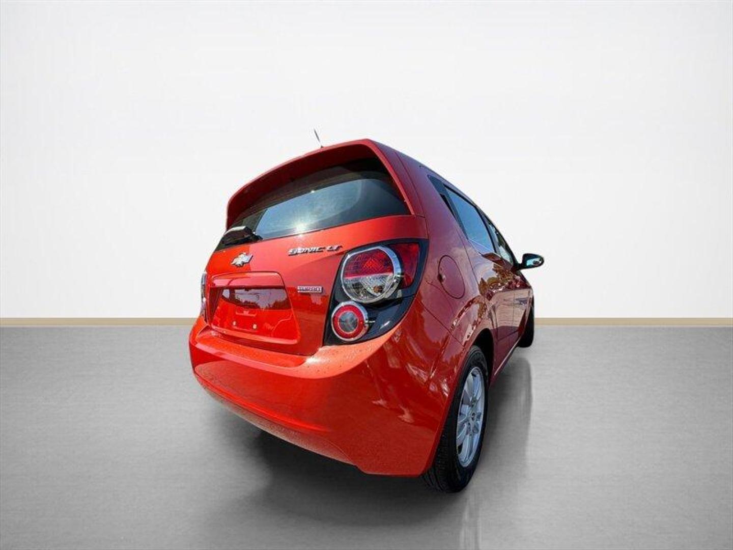 2012 Crystal Red Tintcoat Chevrolet Sonic 1LT (1G1JD6SB3C4) with an Ecotec 1.4L Turbo I4 138hp 148ft. lbs. engine, 5 Speed Manual transmission, located at 25355 Eames Street, Channahon, IL, 60410, (815) 467-1807, 41.429108, -88.228432 - Unleash the power and style of this 2012 Chevrolet Sonic LT, roaring into the spotlight with its standout Inferno Orange Metallic exterior that demands attention wherever you roll. Under the hood, the fierce Ecotec 1.4L Turbo I4 engine pumps out a solid 138 horsepower and 148 ft-lbs of torque, deliv- Photo#1