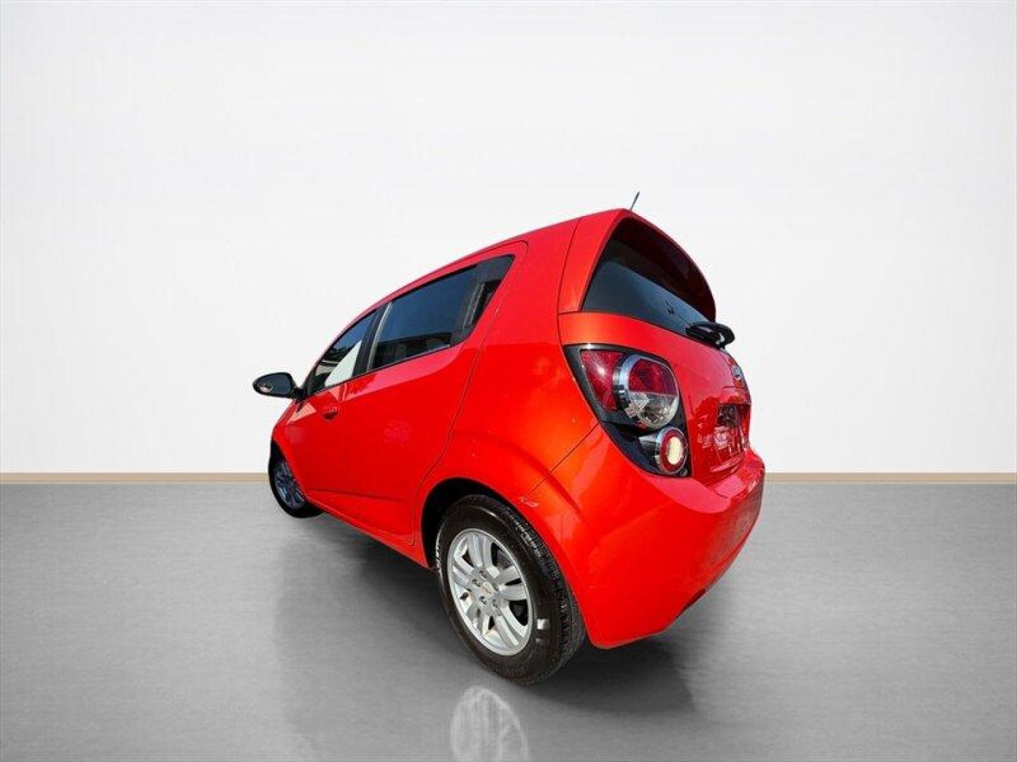 2012 Crystal Red Tintcoat Chevrolet Sonic 1LT (1G1JD6SB3C4) with an Ecotec 1.4L Turbo I4 138hp 148ft. lbs. engine, 5 Speed Manual transmission, located at 25355 Eames Street, Channahon, IL, 60410, (815) 467-1807, 41.429108, -88.228432 - Unleash the power and style of this 2012 Chevrolet Sonic LT, roaring into the spotlight with its standout Inferno Orange Metallic exterior that demands attention wherever you roll. Under the hood, the fierce Ecotec 1.4L Turbo I4 engine pumps out a solid 138 horsepower and 148 ft-lbs of torque, deliv- Photo#4