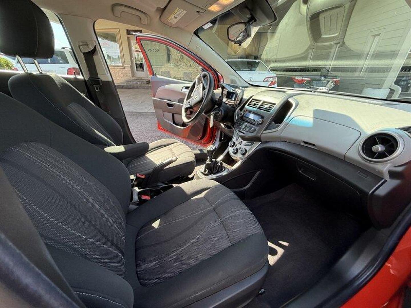 2012 Crystal Red Tintcoat Chevrolet Sonic 1LT (1G1JD6SB3C4) with an Ecotec 1.4L Turbo I4 138hp 148ft. lbs. engine, 5 Speed Manual transmission, located at 25355 Eames Street, Channahon, IL, 60410, (815) 467-1807, 41.429108, -88.228432 - Unleash the power and style of this 2012 Chevrolet Sonic LT, roaring into the spotlight with its standout Inferno Orange Metallic exterior that demands attention wherever you roll. Under the hood, the fierce Ecotec 1.4L Turbo I4 engine pumps out a solid 138 horsepower and 148 ft-lbs of torque, deliv- Photo#14