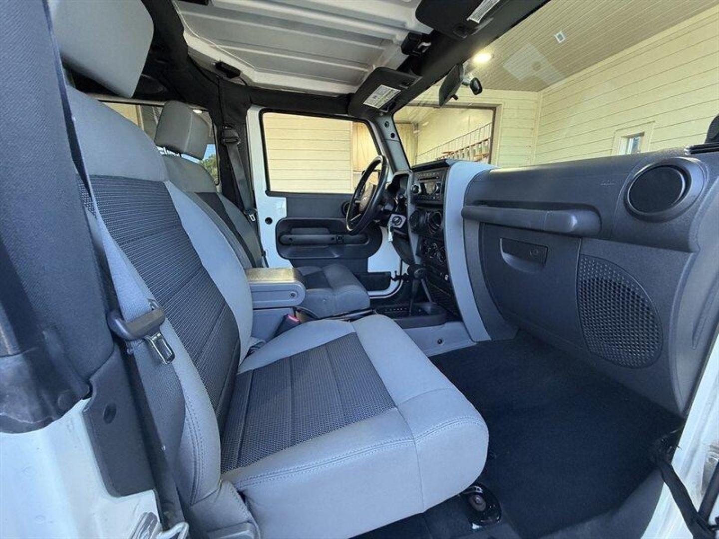2010 Stone White Clear Coat Jeep Wrangler Sport (1J4AA2D11AL) with an 3.8L V6 202hp 237ft. lbs. engine, Automatic transmission, located at 25355 Eames Street, Channahon, IL, 60410, (815) 467-1807, 41.429108, -88.228432 - Some vehicles are transportation. Some are a lifestyle. This Wrangler is the real deallow miles, freshly serviced, and ready for whatever adventure comes next. 4x4 Low miles Hard top Cold A/C New tires New front brakes Freshly serviced No fancy gimmicks. No unnecessary extras. Just a classic Wran- Photo#11