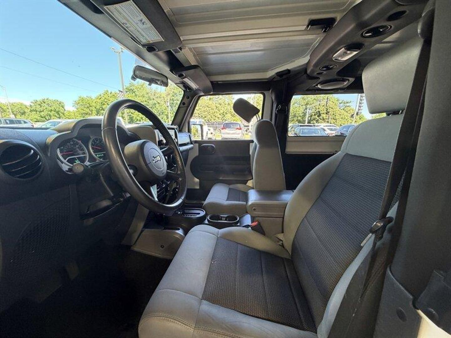 2010 Stone White Clear Coat Jeep Wrangler Sport (1J4AA2D11AL) with an 3.8L V6 202hp 237ft. lbs. engine, Automatic transmission, located at 25355 Eames Street, Channahon, IL, 60410, (815) 467-1807, 41.429108, -88.228432 - Some vehicles are transportation. Some are a lifestyle. This Wrangler is the real deallow miles, freshly serviced, and ready for whatever adventure comes next. 4x4 Low miles Hard top Cold A/C New tires New front brakes Freshly serviced No fancy gimmicks. No unnecessary extras. Just a classic Wran- Photo#14