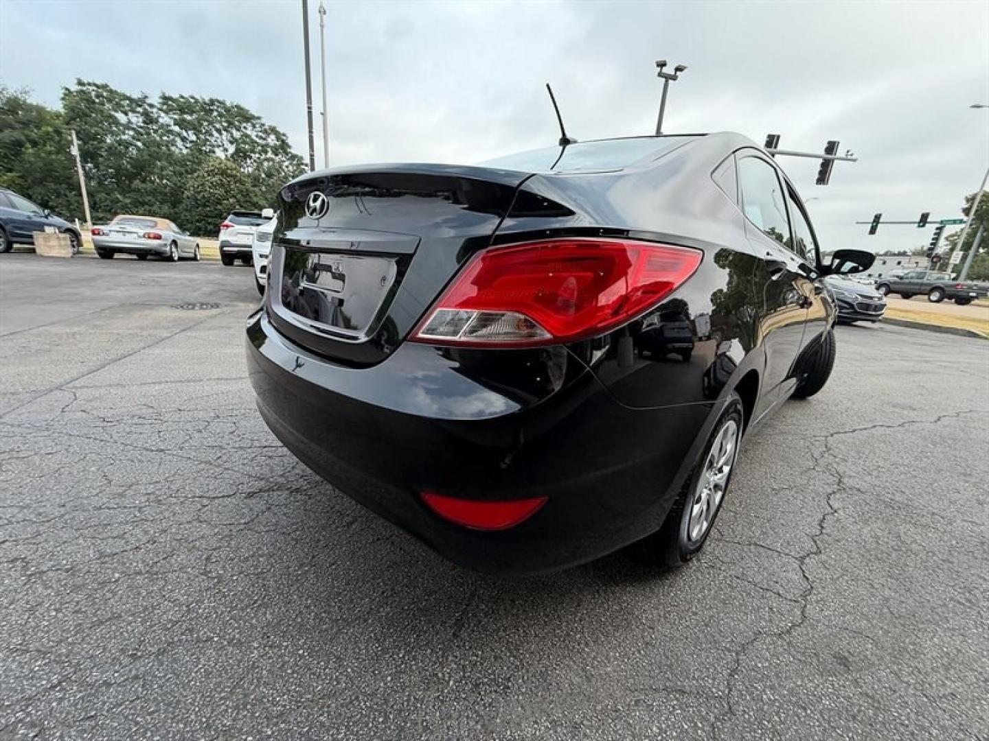 2015 Ultra Black Hyundai ACCENT GLS (KMHCT4AE3FU) with an 1.6L I4 137hp 123ft. lbs. engine, Automatic transmission, located at 25355 Eames Street, Channahon, IL, 60410, (815) 467-1807, 41.429108, -88.228432 - Experience reliable efficiency with this 2015 Hyundai ACCENT GLS, featuring a 1.6L I4 engine delivering 137 horsepower and 123 ft-lbs of torque. The Ultra Black exterior complements the clean Gray interior, creating a sleek and understated look. This ACCENT has been driven less than 63,000 miles, av- Photo#3