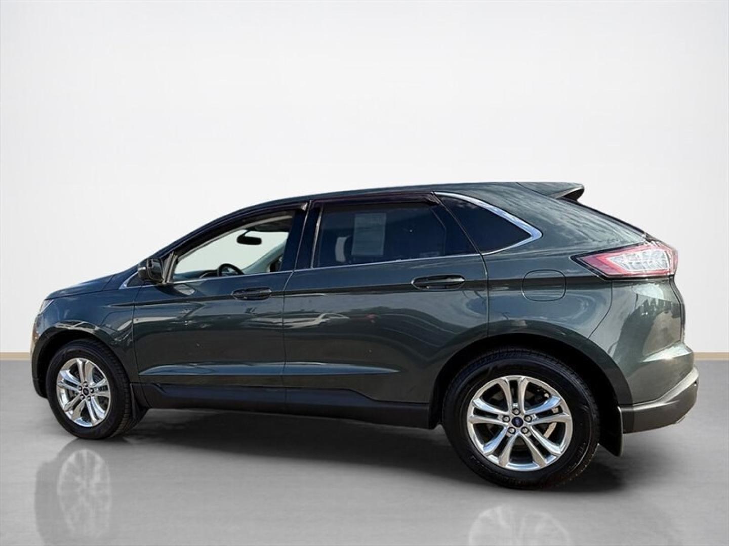 2015 Magnetic Metallic Ford Edge SEL (2FMTK4J8XFB) with an 3.5L V6 280hp 250ft. lbs. engine, Automatic transmission, located at 25355 Eames Street, Channahon, IL, 60410, (815) 467-1807, 41.429108, -88.228432 - 2015 Ford Edge SEL AWD because practical doesnt have to mean painfully boring. This ONE-OWNER, LOCAL TRADE brings the comforts you want with a little attitude to match. Heated leather seats? Obviously. Panoramic roof? Let the sunshine judge your playlist. 3.5L V6 engine All-wheel drive Heated- Photo#6